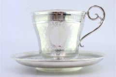 Cup and saucer in guilloche silver with pearl engraving, with monogram card