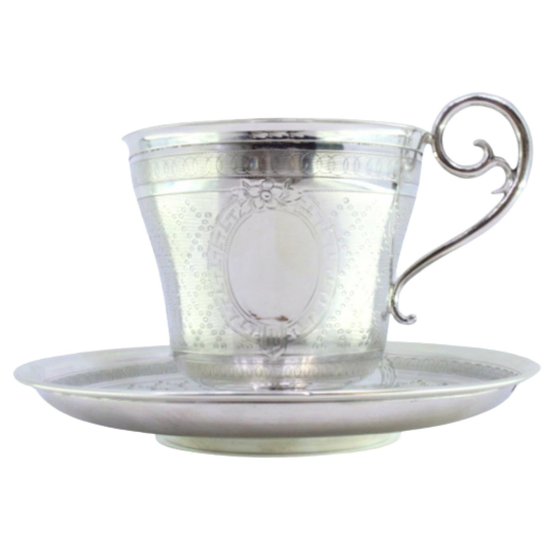 Cup and saucer in guilloche silver with pearl engraving, with monogram card