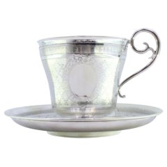Cup and saucer in guilloche silver with pearl engraving, with monogram card