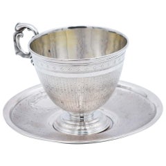 Cup and saucer in guilloche silver with pearlescent reliefs and monogram plaque