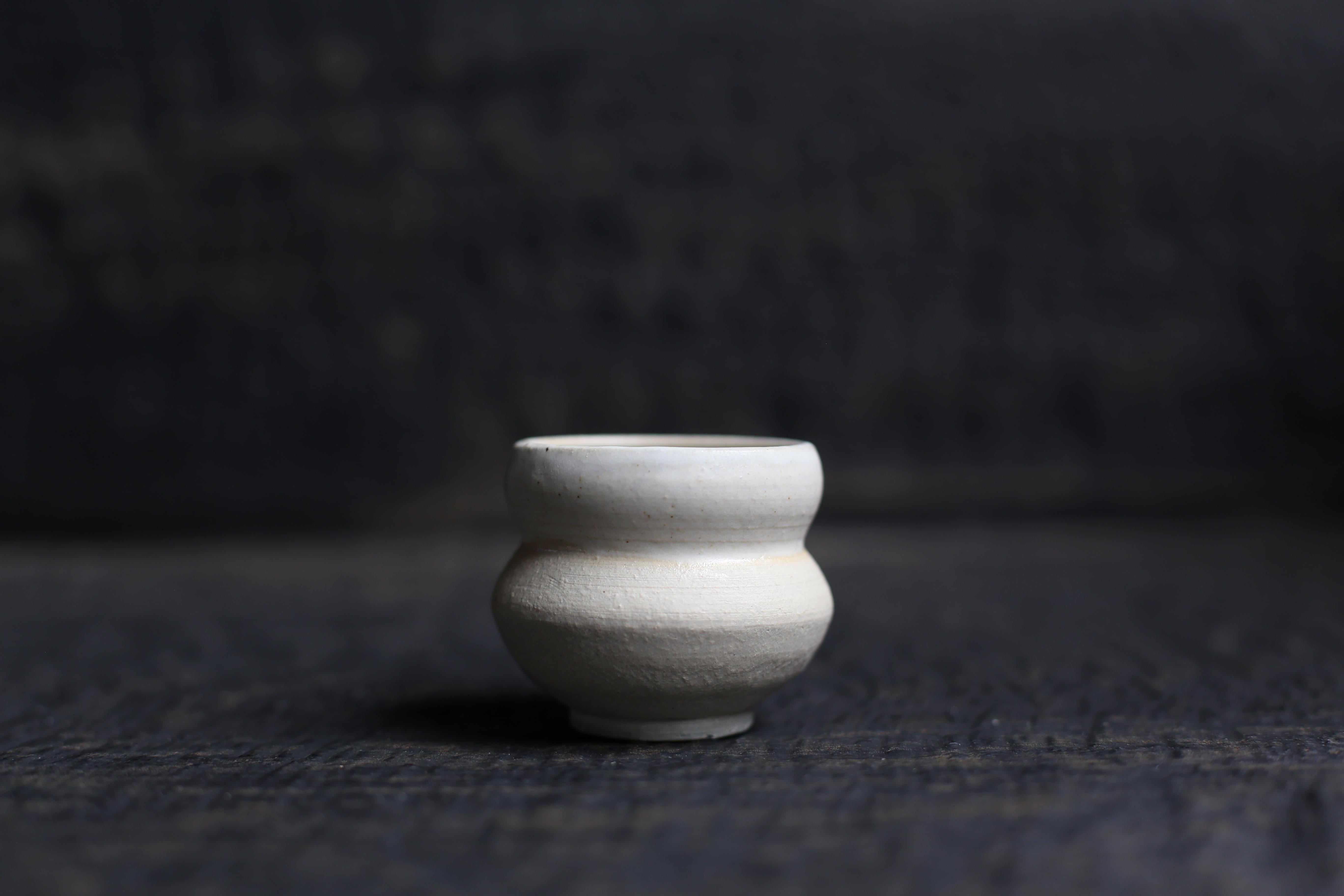Cup in White Clay with MatteSand + Sheer Glaze
front row
2022s / Belgium
Size : f60 h60 mm
Artist : Sigrid Volders


[Sigrid Volders]
Based in Antwerp, Belgium, she works vigorously as a ceramic artist, mainly as a hair-making artist active