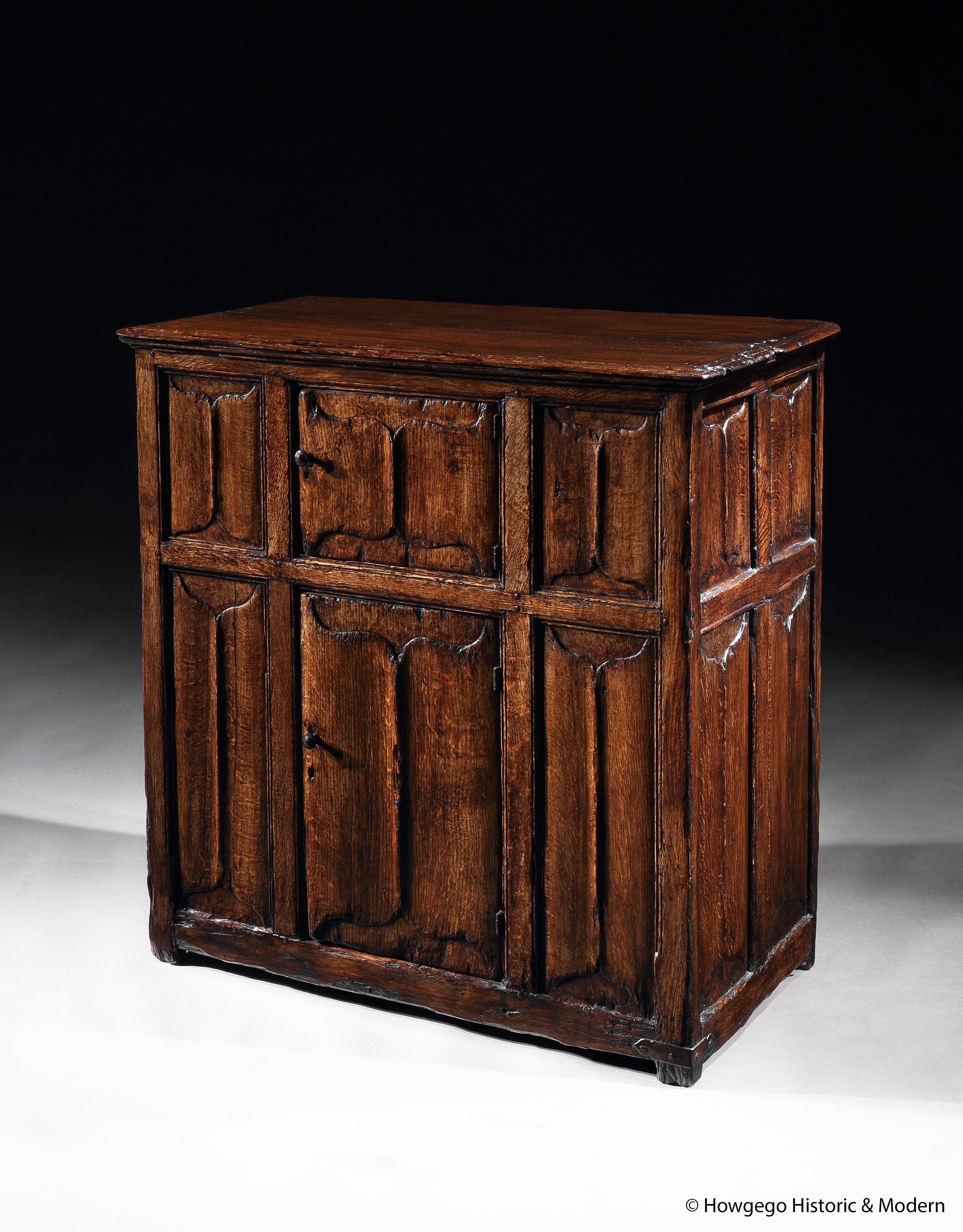 - Rare 17th century interpretation of a Gothic cupboard
- Probably made for family living space due to unusual, small proportions with narrow size and height or made to store expensive, luxury, items
- Lovely color and patina

Top in two