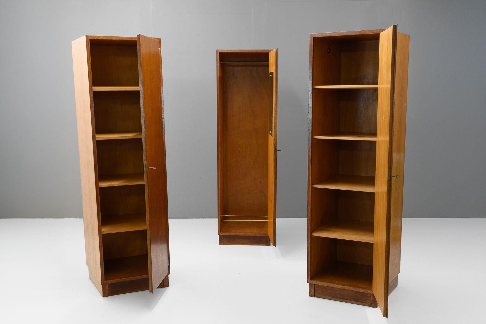 Set of three single wardrobes/cupboards by Franz Schuster. Minimal design constructed from oak. Circa 1929.
H 180cm x W 51cm/153cm x D 55cm