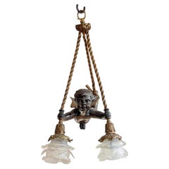 Cupid Cherub Form Gilt and Patinated Bronze Chandelier
