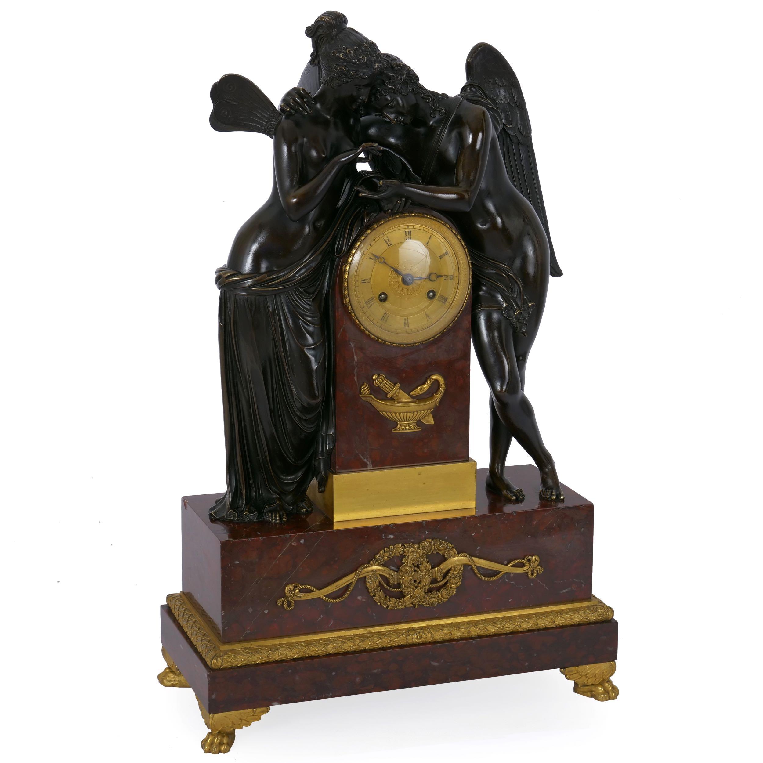 An exceptional French Empire period mantel clock with finely chiseled elements throughout, this work captures Psyche placing a butterfly (now absent) into the open palm of cupid. Each figure is cast with incredible skill, this self evident in the