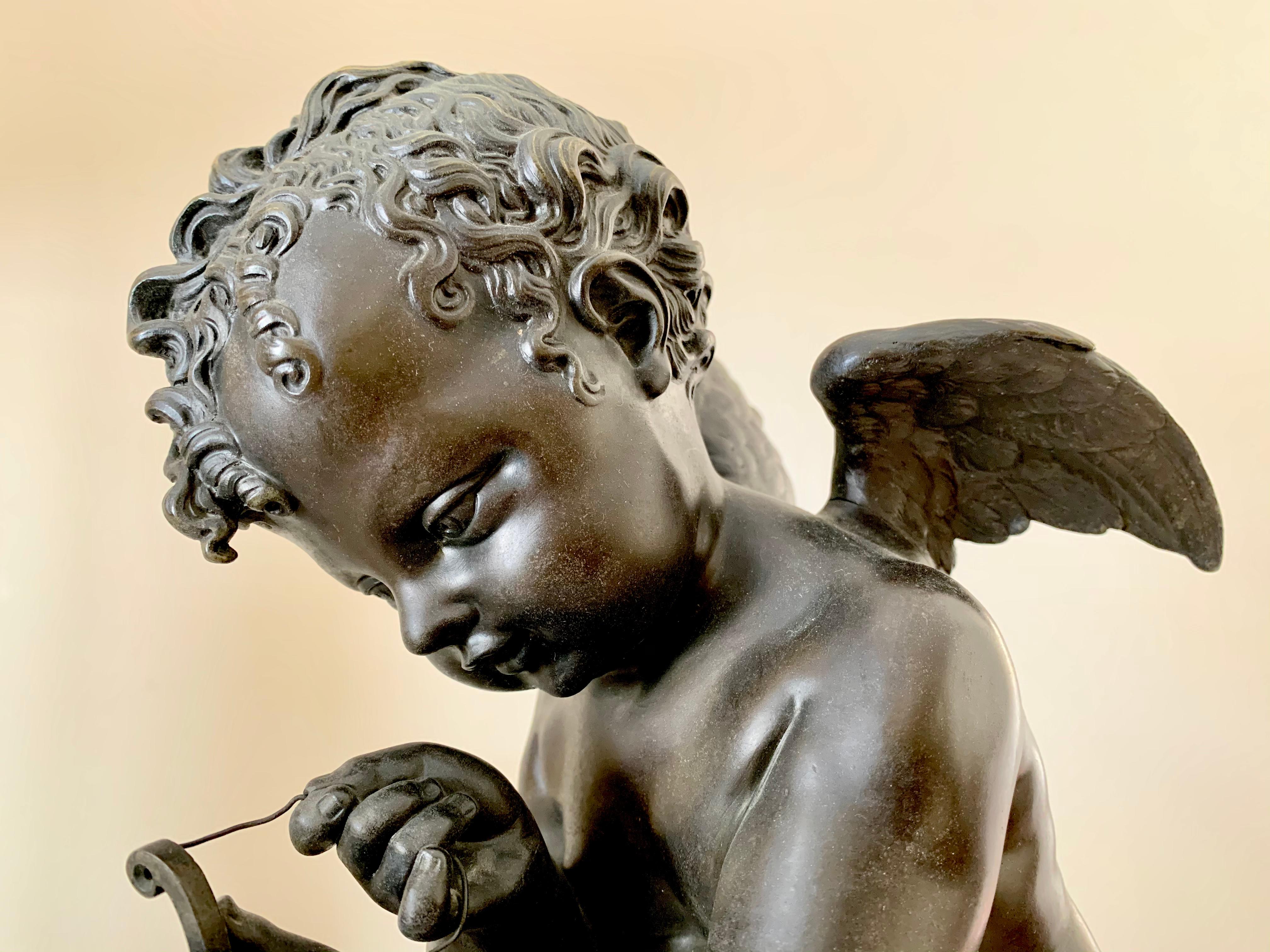 Beautiful antique bronze of cupid stringing his bow signed Lemire. Charles Gabriel Sauvage (1741-1827), called Lemire pere, was a noted French sculptor who worked in bronze as well as porcelain. His figural group of Louis XVI and Benjamin Franklin