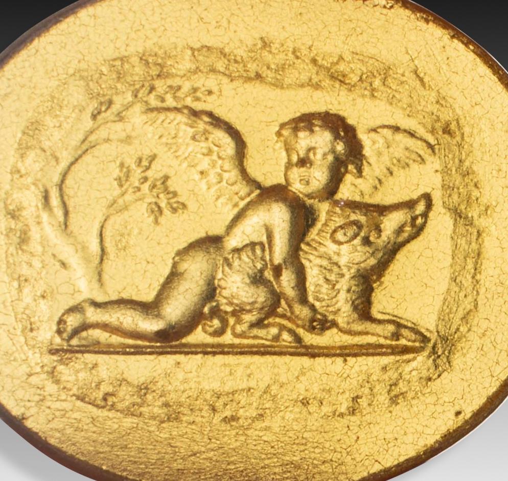 Cupid with boar. Glass. 19th century. 
Glass cameo depicting a cherub or cupid accompanied by a boar, modelled on an amethyst from the Thomas Dundass Collection, reproduced in an engraving by Thomas Worlidge (One Hundred and Eight Engravings from