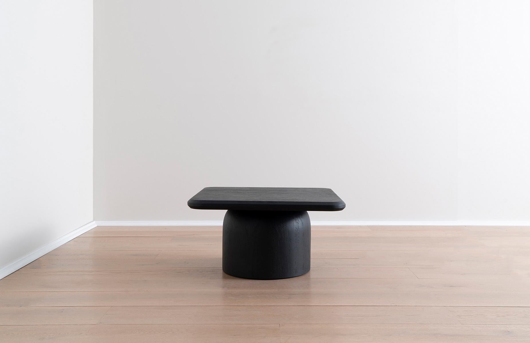 This black square coffee table is crafted from responsibly sourced conacaste wood and draws inspiration from Spanish architecture found within Antigua, Guatemala. By reimagining architectural elements found in the city — sloping rooftops, domes, and