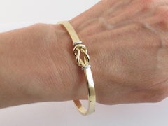 Curata Italian 14k Two Tone Gold Love Knot Hinged Stackable Bangle Bracelet
