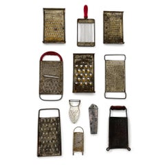 Curated Collection of Eleven Antique and Vintage Metal Kitchen Graters and Shred