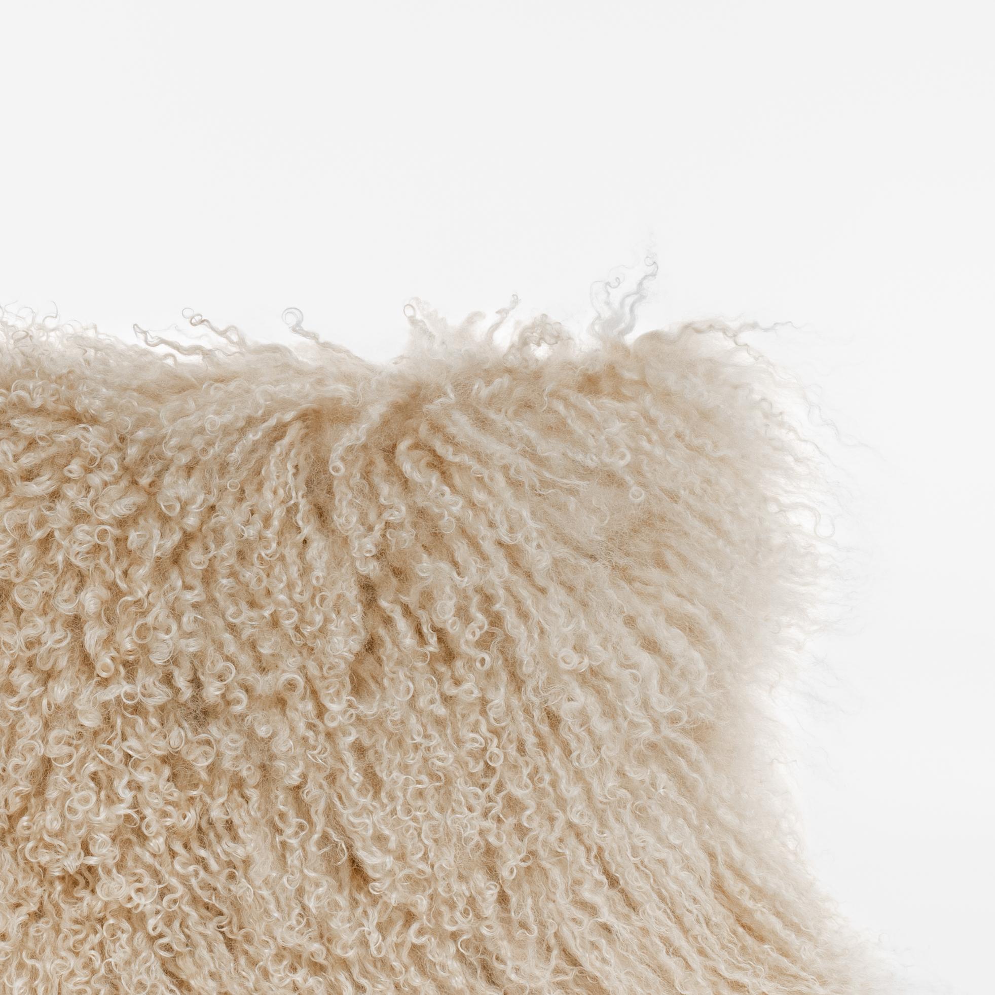 This cushion is handcrafted in our Atelier in Italy using only the best materials, starting from real Tibet Lamb fur. Its particular look allows this piece to both stand out or blend in your spaces, while keeping its nature of a soft and useful