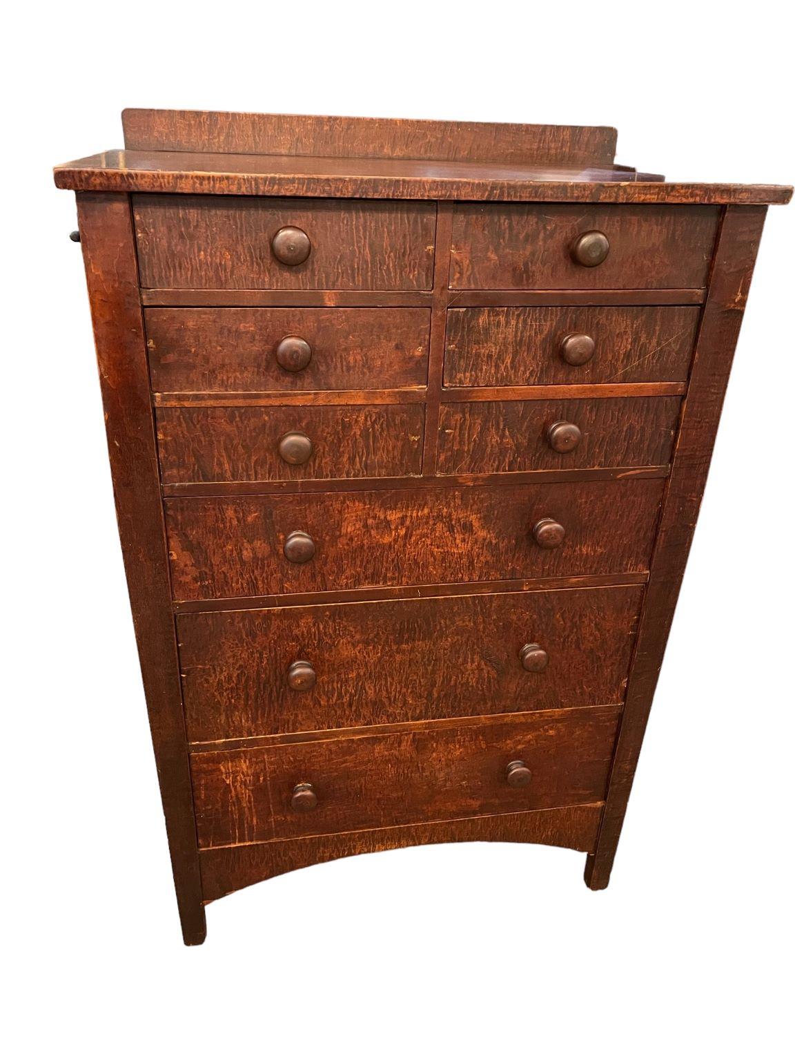 Beautiful Gustav Stickley nine drawer chest of drawers attributed to Harvey Ellis. A rare chest done in stained Curley Maple. Marked on back of chest with an early Gustav Stickley mark. A few small chips near bottom that does not diminish the beauty