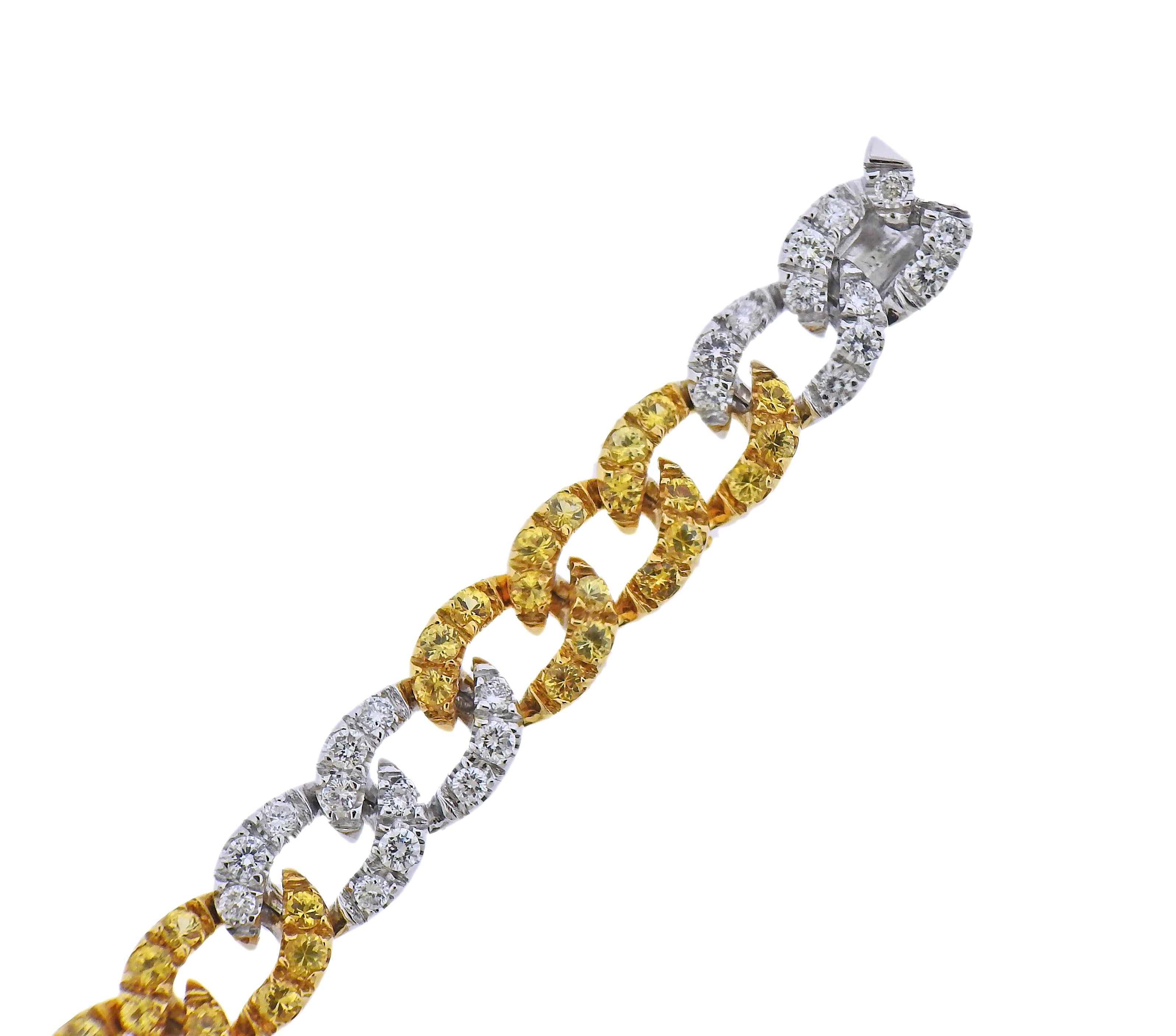 18k gold curb link bracelet signed by Curnis, with yellow sapphires and approx. 2.50ctw in diamonds. Bracelet is 6 7/8