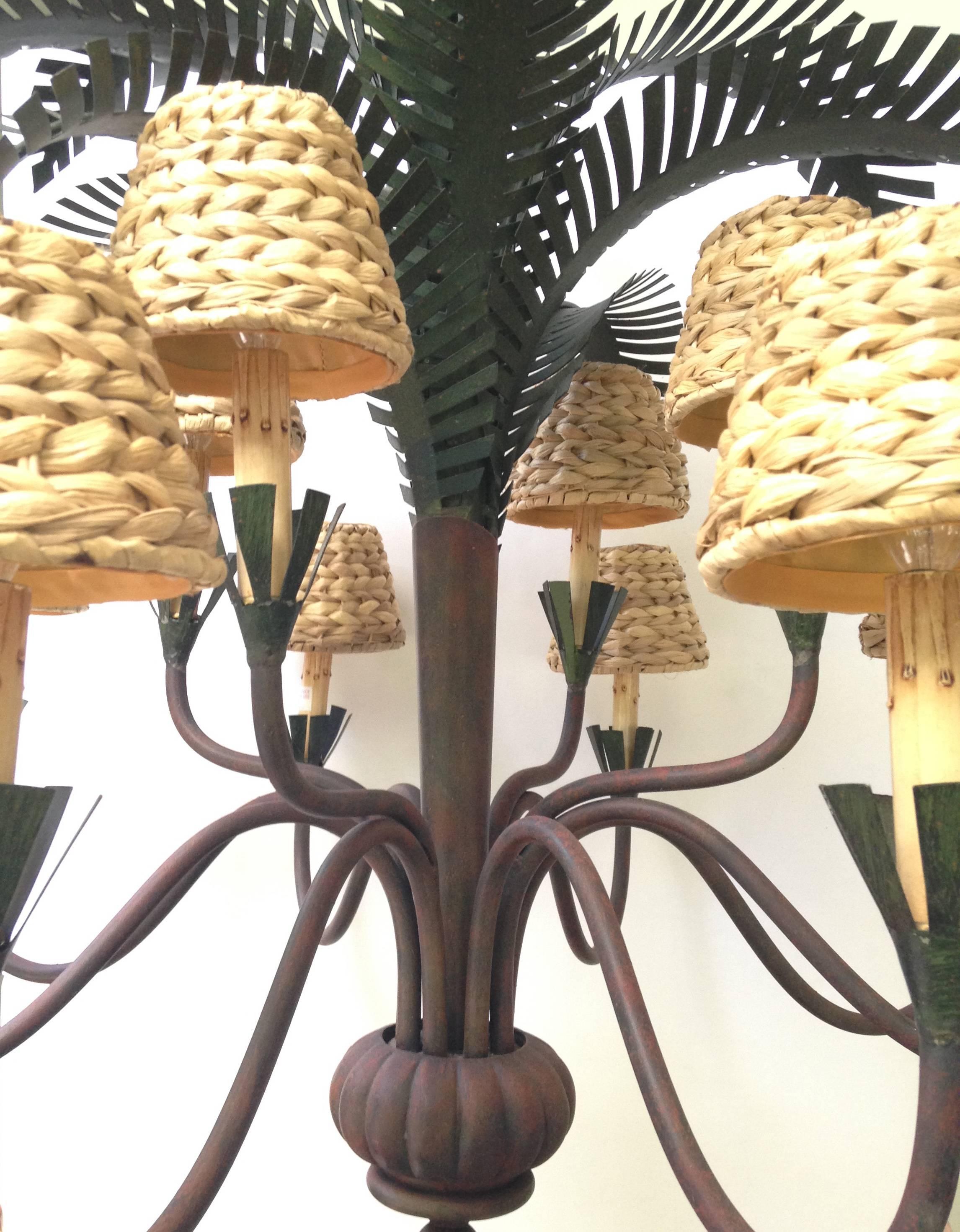This striking 12-light Chandelier by Currey & Company will enhance your home with a perfect mix of form and function. Very good vintage condition. Original wiring.  Perfect working order. Can be hung with or without rattan shades. Perfect statement