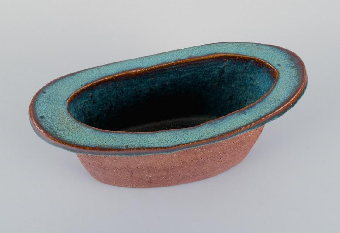 Late 20th Century Curt Addin, large bowl in chamotte clay. Interior with turquoise glaze. For Sale