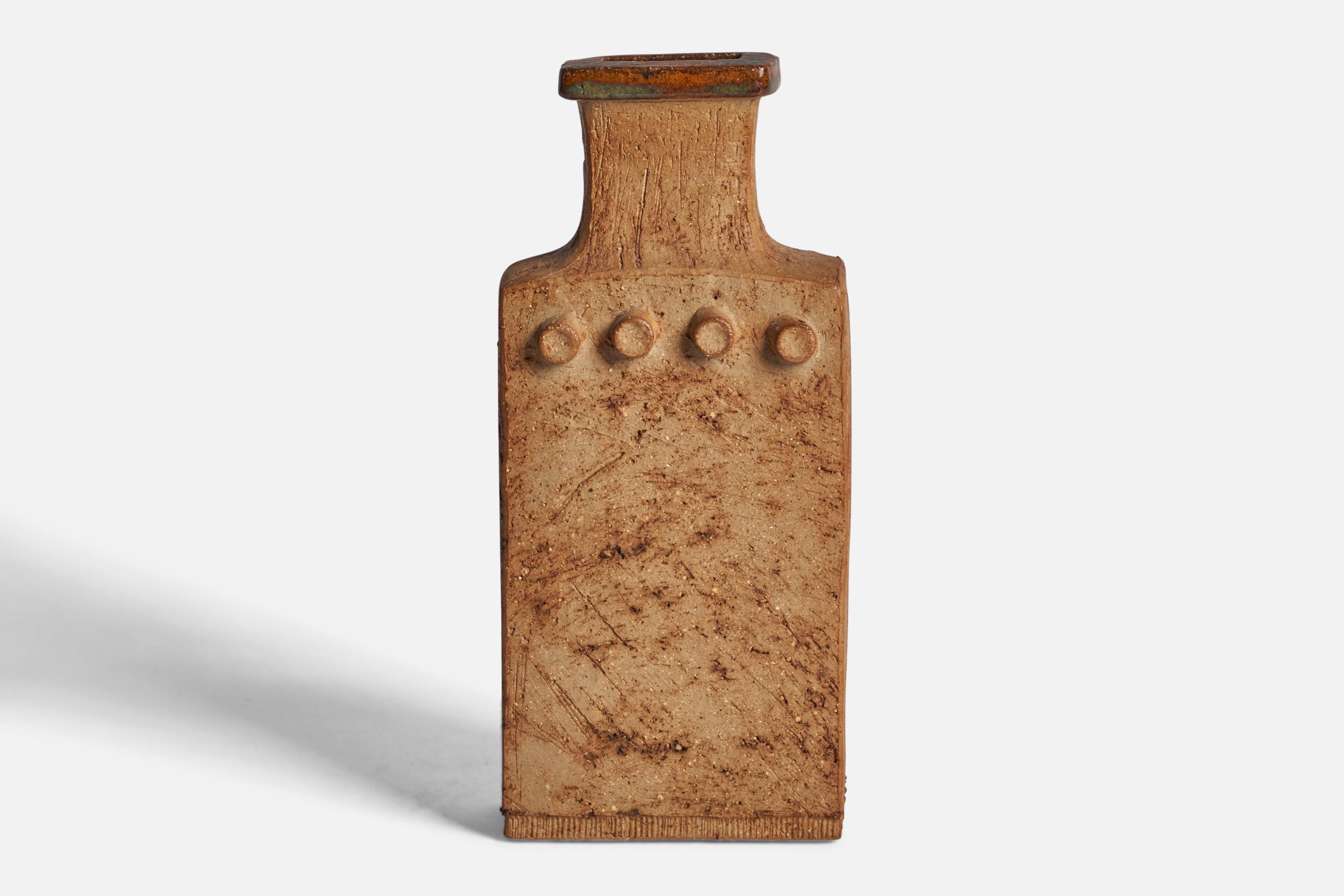 A semi-glazed stoneware vase designed and produced by Curt Addin, Glumslöv, Sweden, 1970s.

“CMA — Curt m. Addin” signature on bottom
