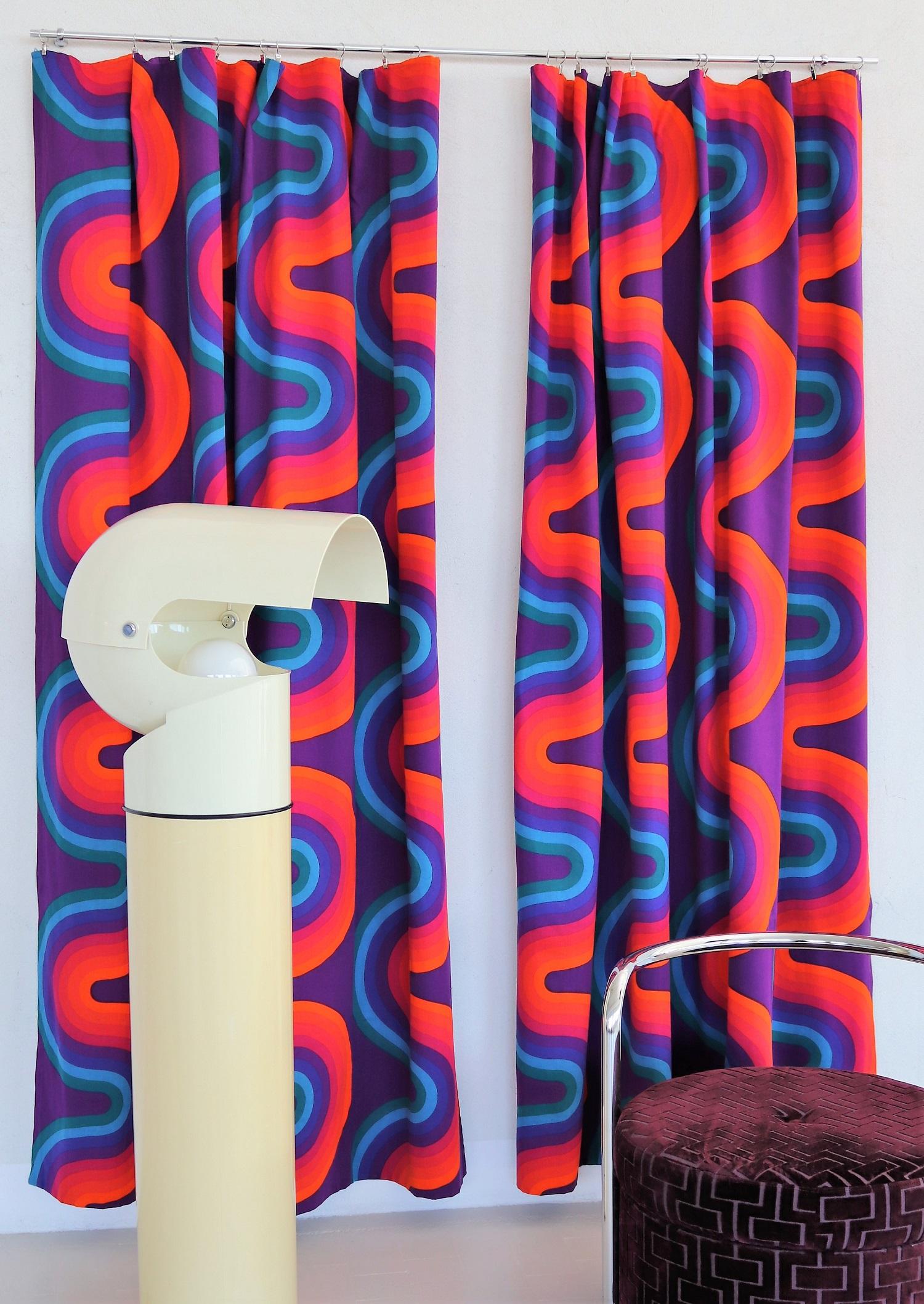 Powerful pair of original curtain panels designed by Verner Panton during, 1969-1971.
100% cotton material, Art. Vitra 139-2.
Printed with 8 pure colors: orange, bright red, dark red, aubergine, mauve, violet, blue and turquoise.
Inside printed with