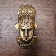 Tribal curtain tie back and clothes hook with elongated mask design