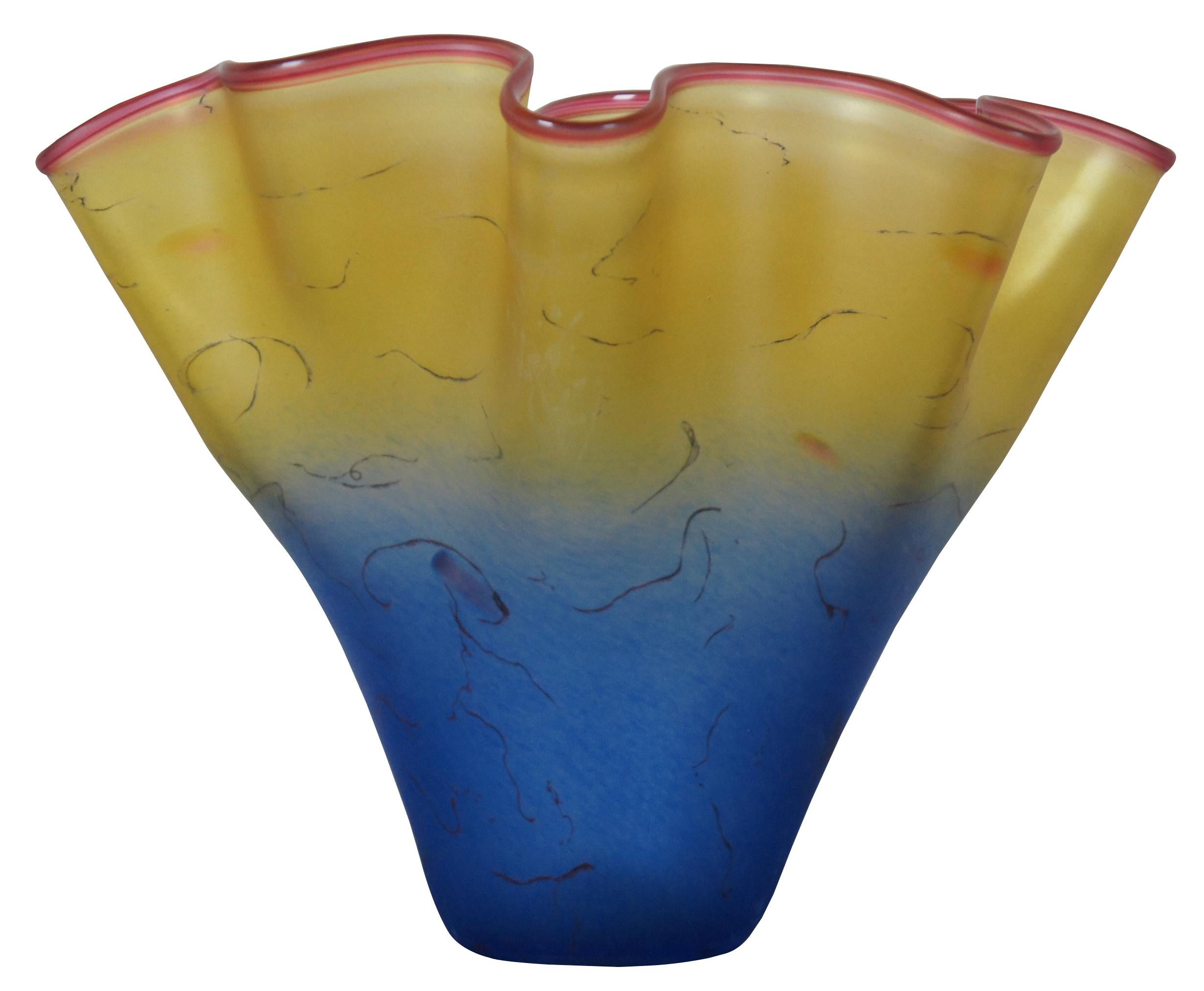 Curtis Brock freeform fluted centerpiece bowl or vase. A flurry of light, trailing lines accents this blown glass bowl with pink lip wrap. Hand-shaped; no two are exactly alike. Measure: 11