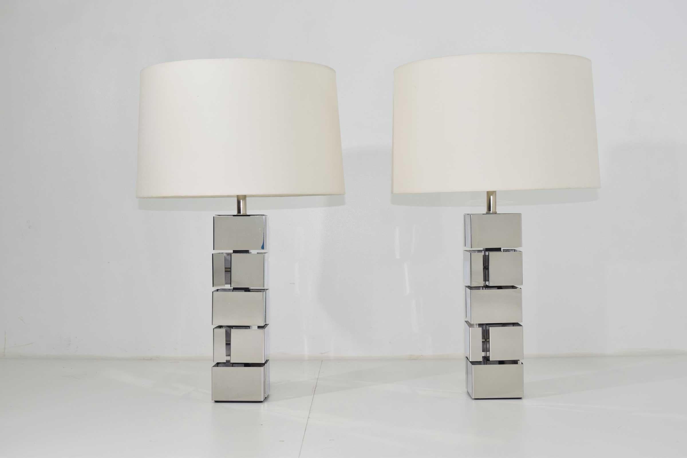 Great looking and in great condition. From great collectors who purchased in 1960s. Pair of polished chrome table lamps in style of Curtis Jere or Paul Evans. Shades not included. Measurements are too top of harp.