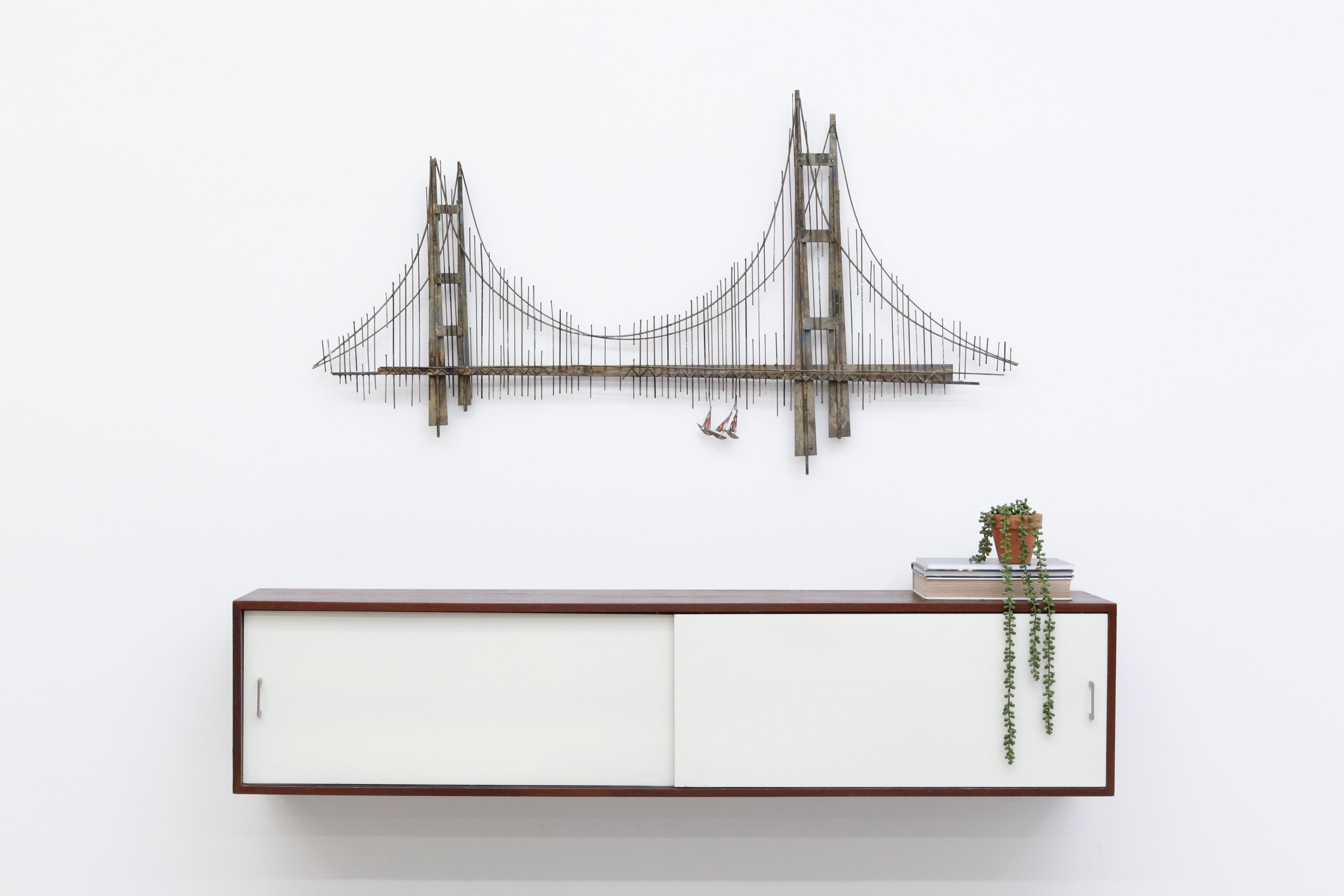 1970's Brutalist sculpture of San Francisco's golden gate bridge by Curtis Jere in original condition with visible patina. Shot with Martin Visser wall mount floating credenza for 't Spectrum (LU922423516662) listed separately.