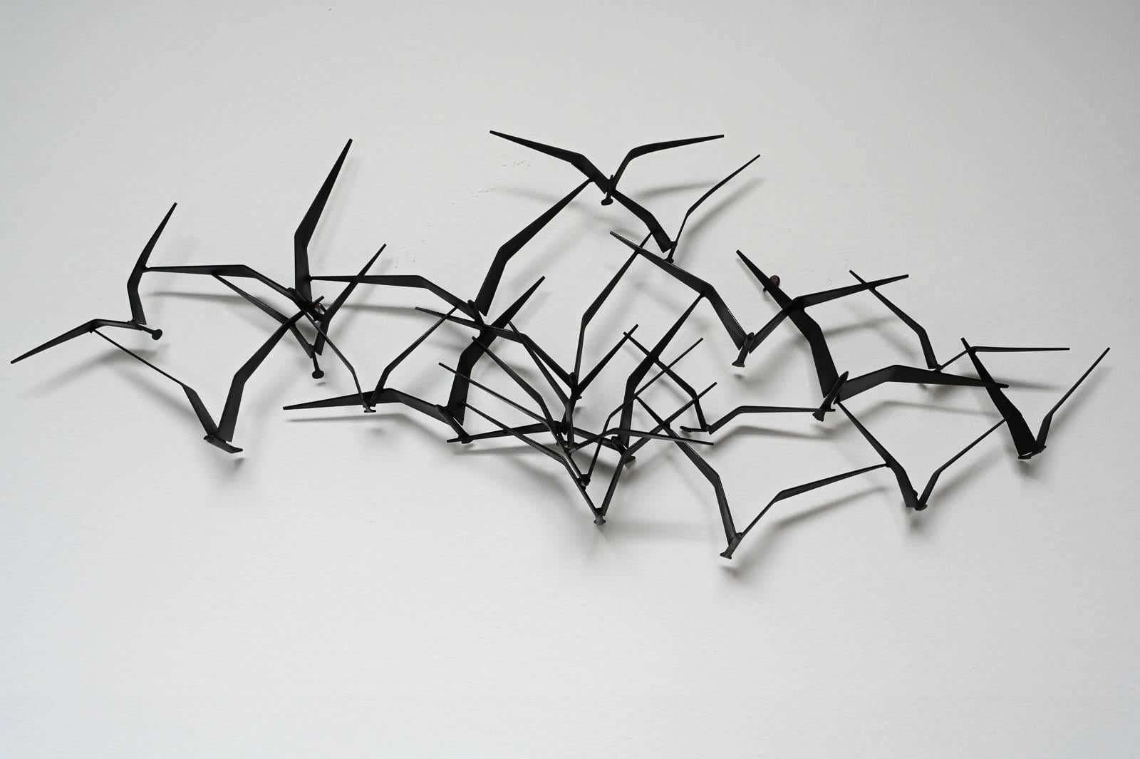 This is a beautiful and original C. Jere 'Birds in Flight' metal Brutalist wall sculpture. Made of solid iron with sculpted birds, this piece is an iconic and Classic Mid-Century design. Incredibly popular and great looking in almost any wall, the
