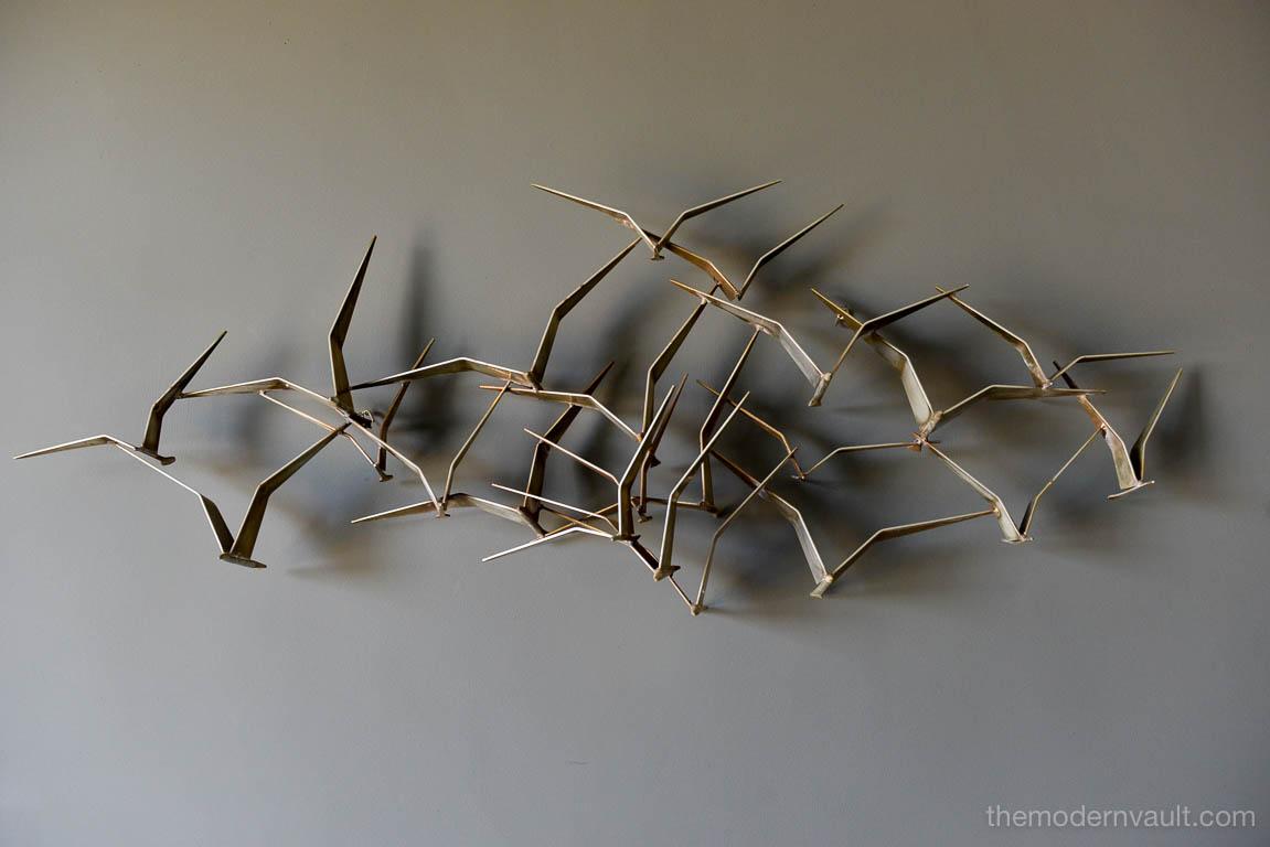 Curtis Jere brass birds in flight wall sculpture, circa 1970. Original brass finish with great patina. Brass finish is more desirable and harder to find than the standard black painted finish, circa 1970. For Artisan House. Beautiful sculptural