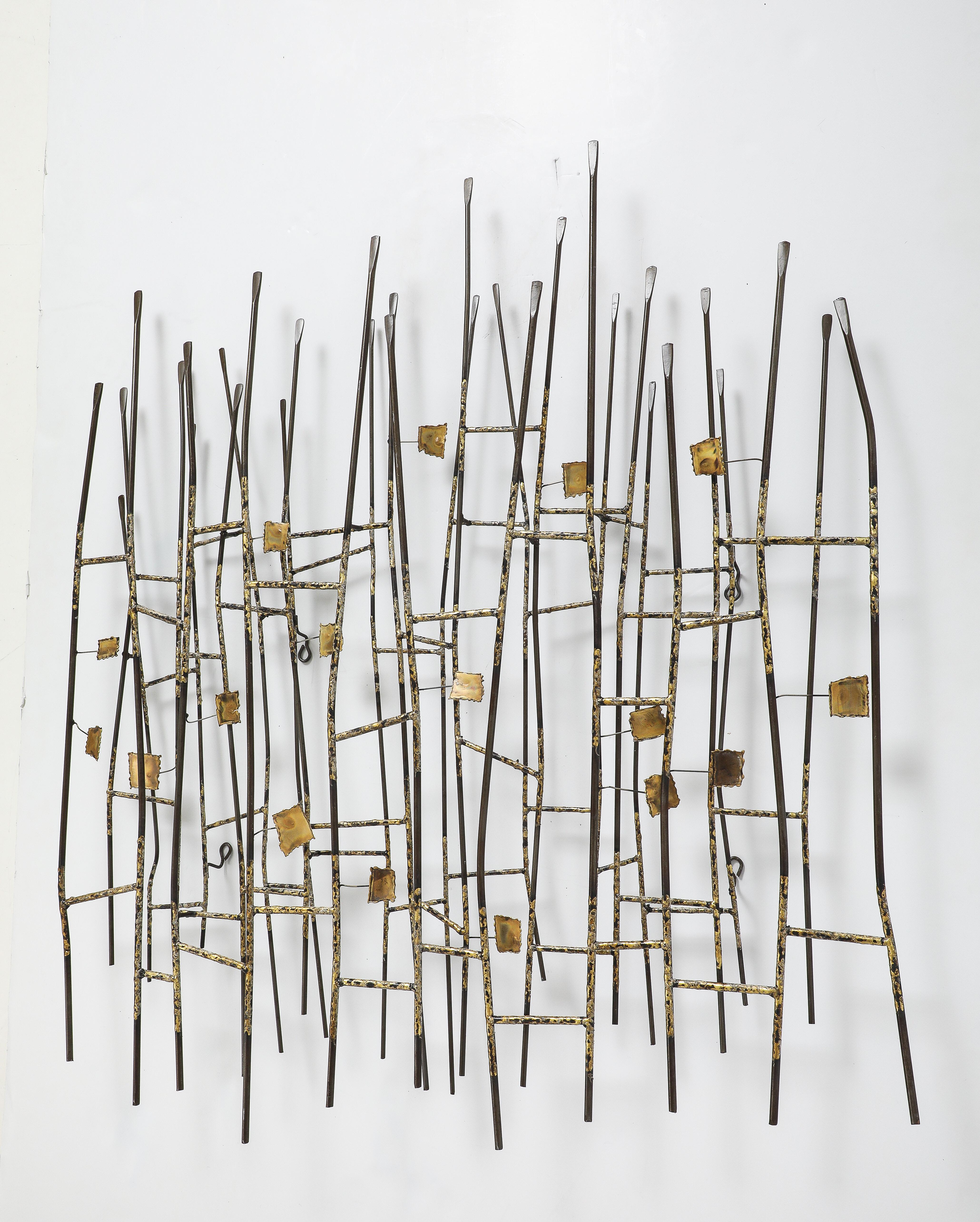 Metal and brass stylized reeds/flax wall sculpture by Curtis Jere. Signed.