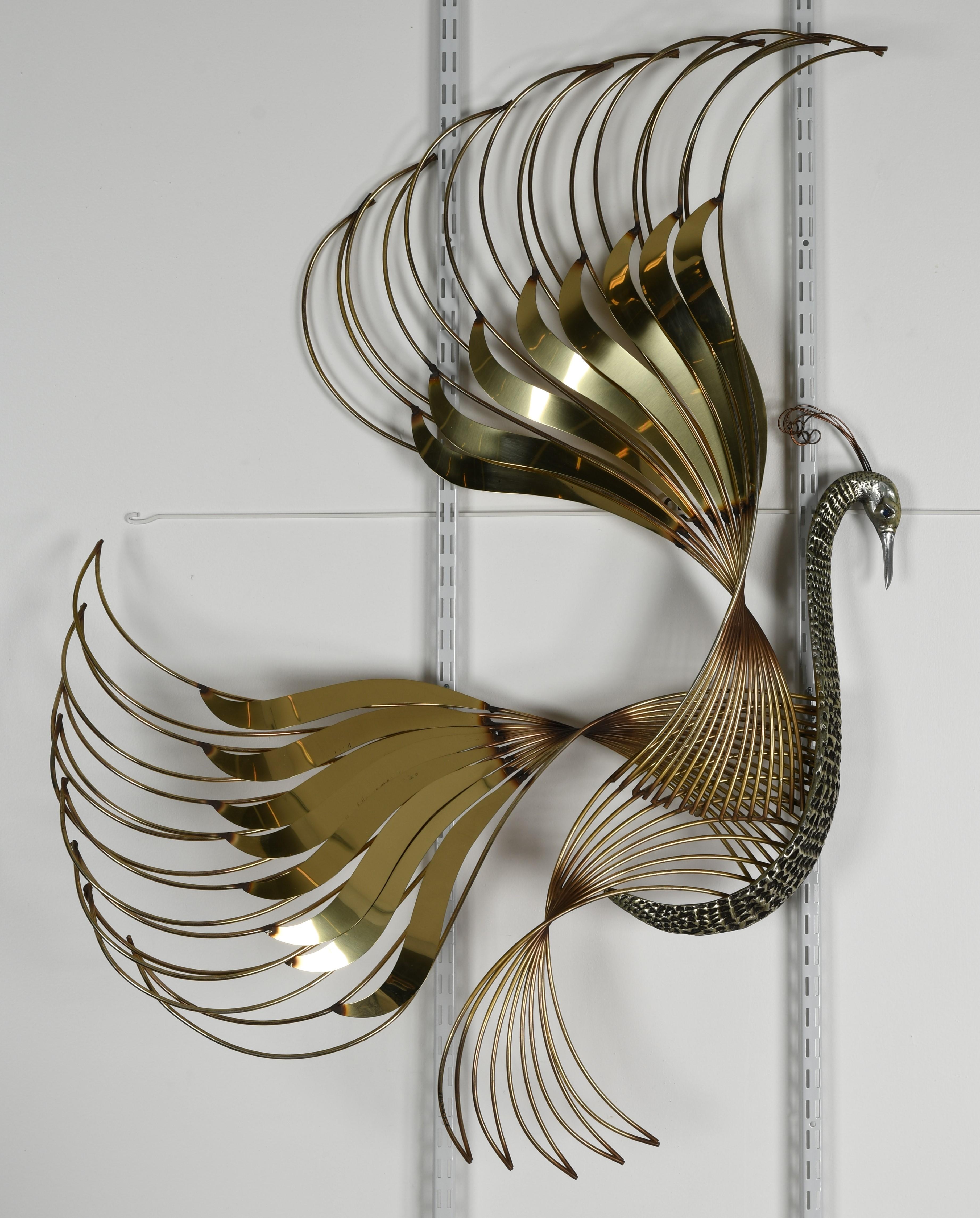 A signed sculptural bird of paradise or peacock wall sculpture by Curtis Jere. This sculpture is signed 
