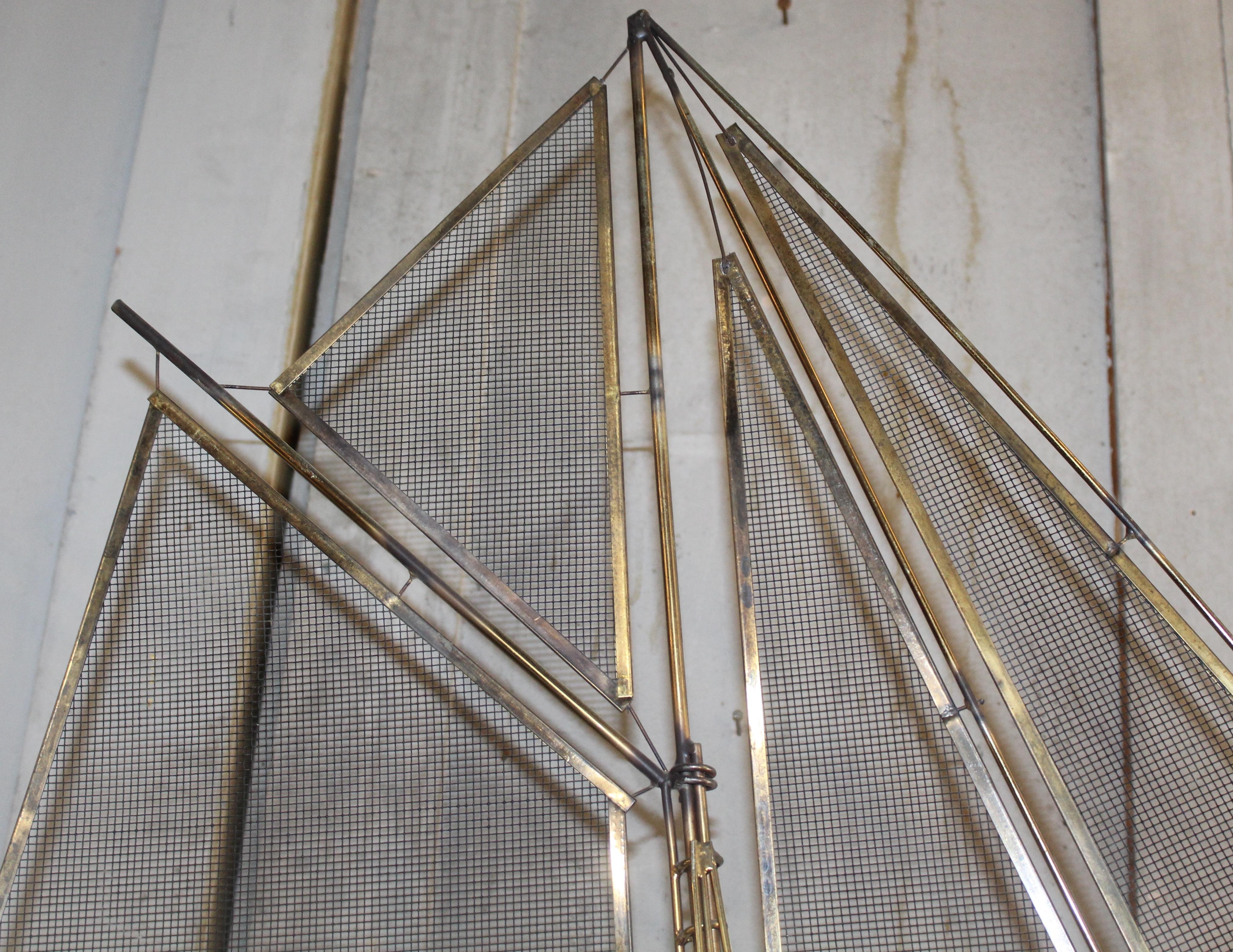 Four foot tall sailboat sculpture made of brass rods welded together. Mesh sails and polished marble base.
Please confirm location NY or NJ
