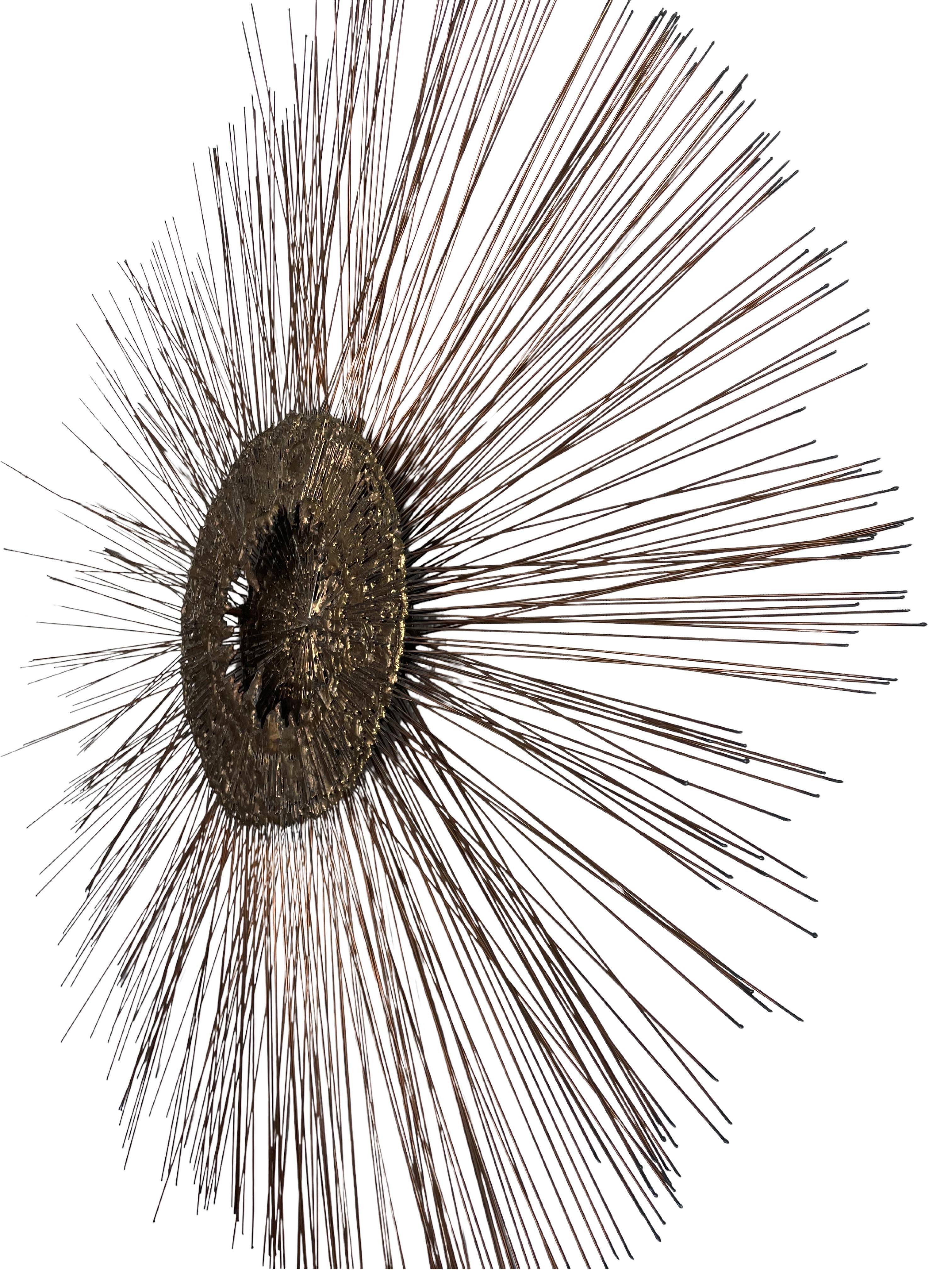 This Curtis Jeré (Curtis Freiler and Jerry Fels) mid-century modern metal starburst wall sculpture is a stunning example of the craftmanship of this team that created some of the most dramatic decorative objects during the ‘60s and ‘70s. This