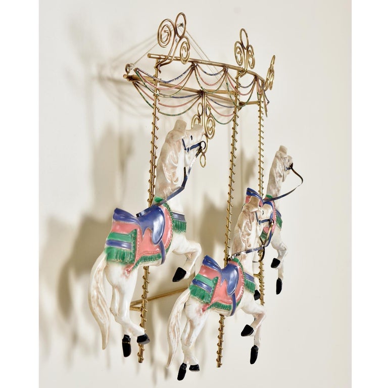Curtis Jere whimsical leaping carousel horse metal wall sculpture: Signed, Curtis Jere, 1987. The sheer size of this piece will fill a room with excitement. The larger than life sculpture spans nearly four feet! This dynamic wall art features three