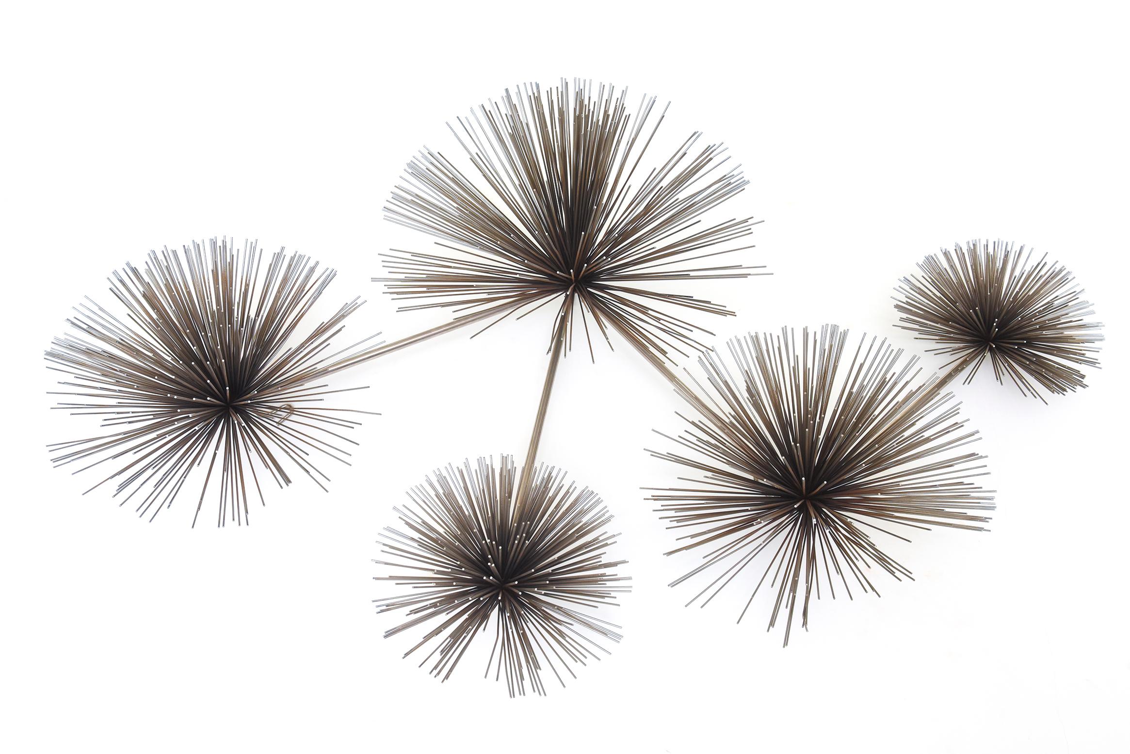 This vintage chrome plated Curtis Jere wall sculpture is from the 1970s. It is not signed that we can see. It is authentic. It is a combination of 5 sea creatures we call sea urchins in a Sputnik form. They are interconnected and this can be hung