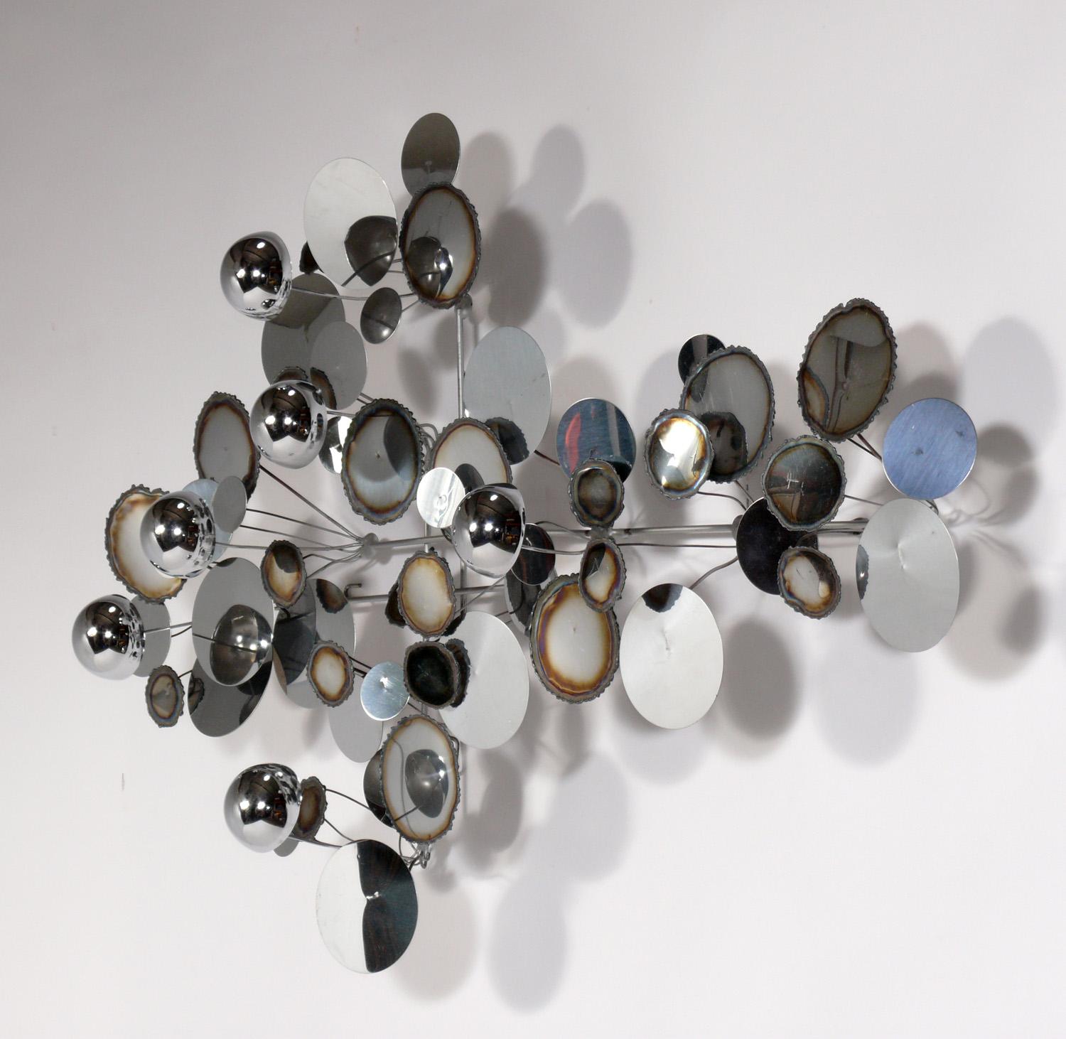 Chrome raindrops wall sculpture, made by Curtis Jere. American, circa 1970s.