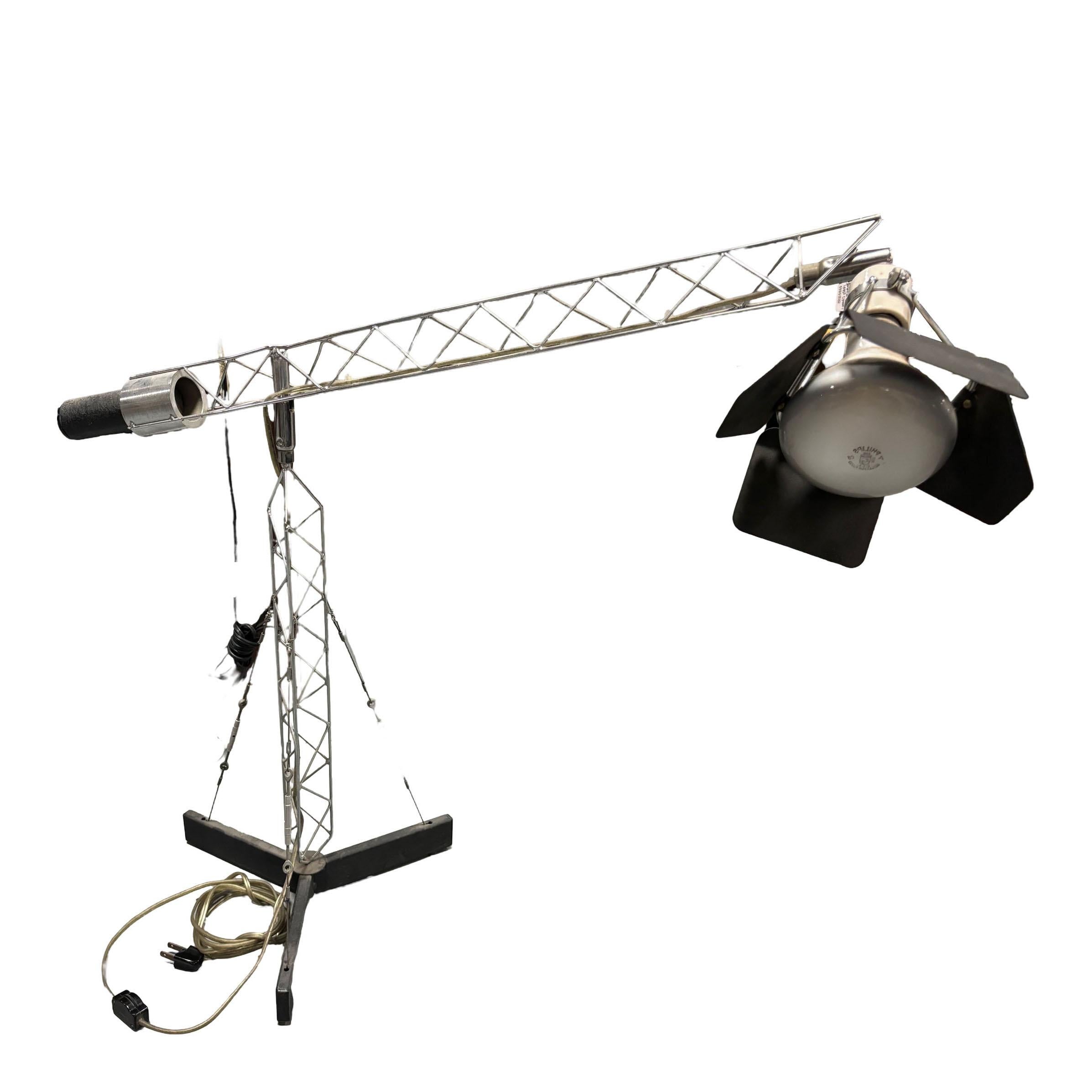 This highly collectible crane table lamp by Curtis Jere features a counterbalanced arm which allows the user to adjust the lamp to their specific needs.

  