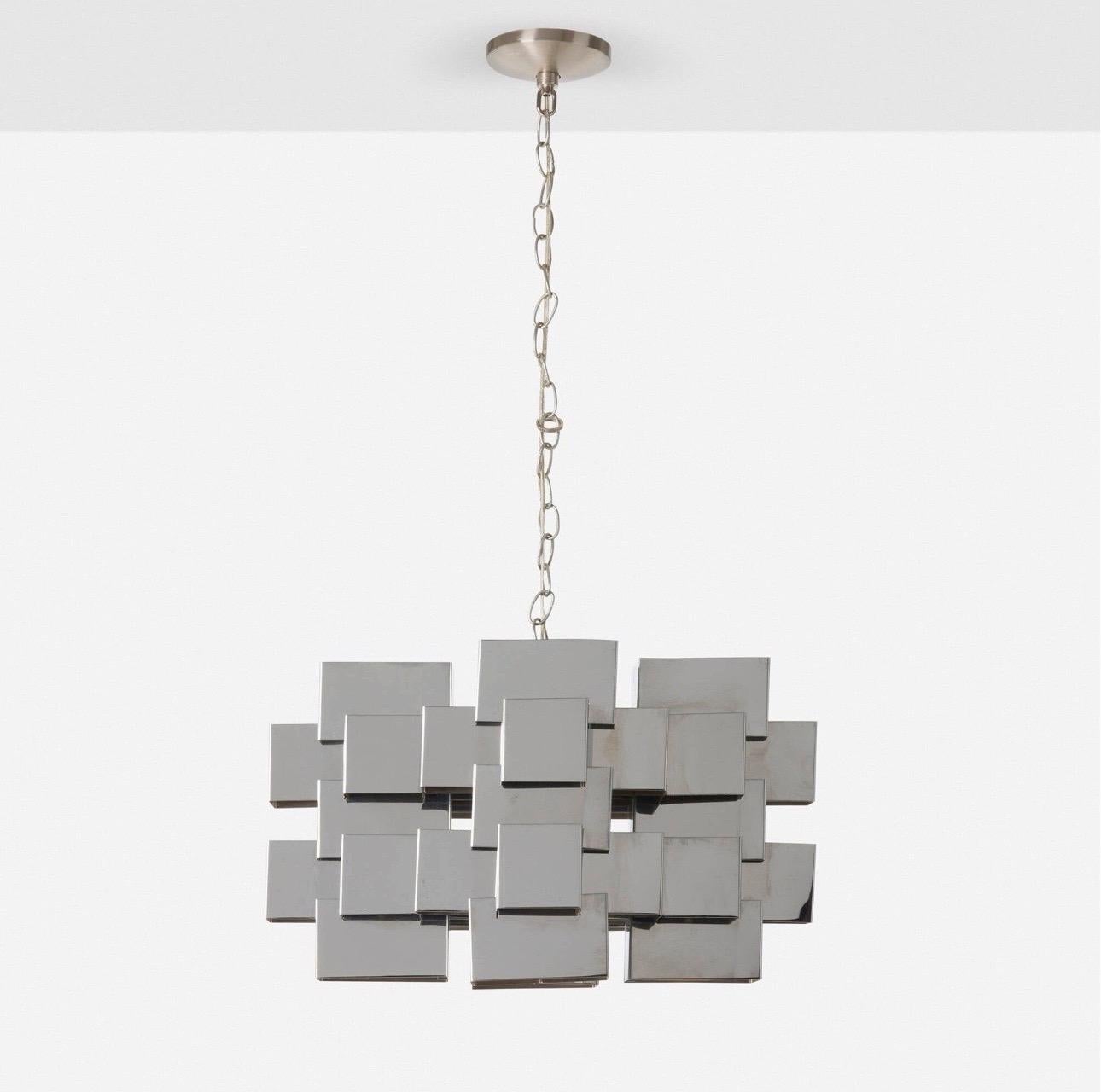 Curtis Jere Cubist style Chrome Chandelier.

USA, c. 1970..

Details:
Crafted of chrome-plated steel.  
Includes a ceiling cap, mounting bracket, and an additional 14 feet of chain and wire. 

Dimensions:
38.25” h drop height x 21” w x 21” d (97 x