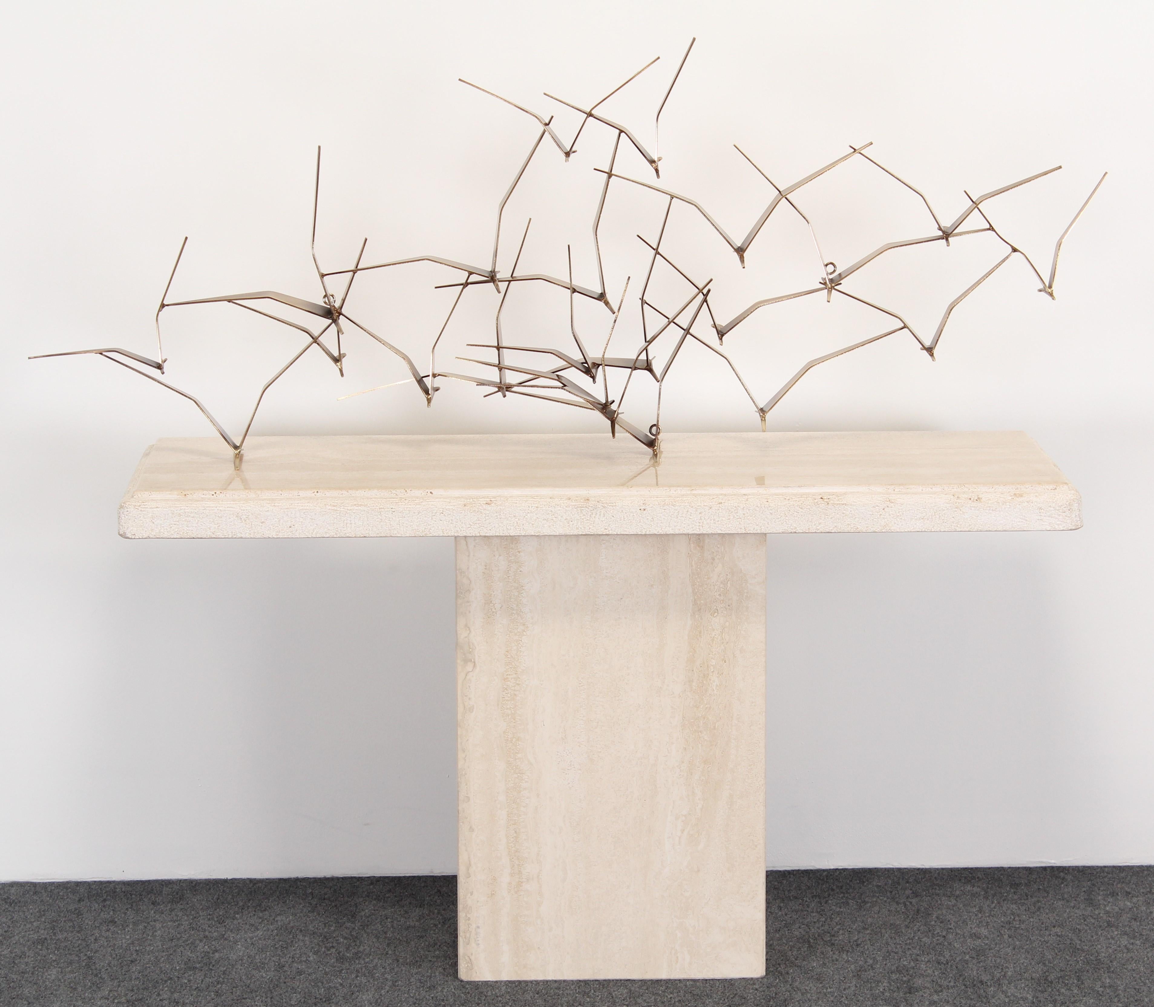 A Mid-Century Modern steel and bronze patina wall sculpture of 
