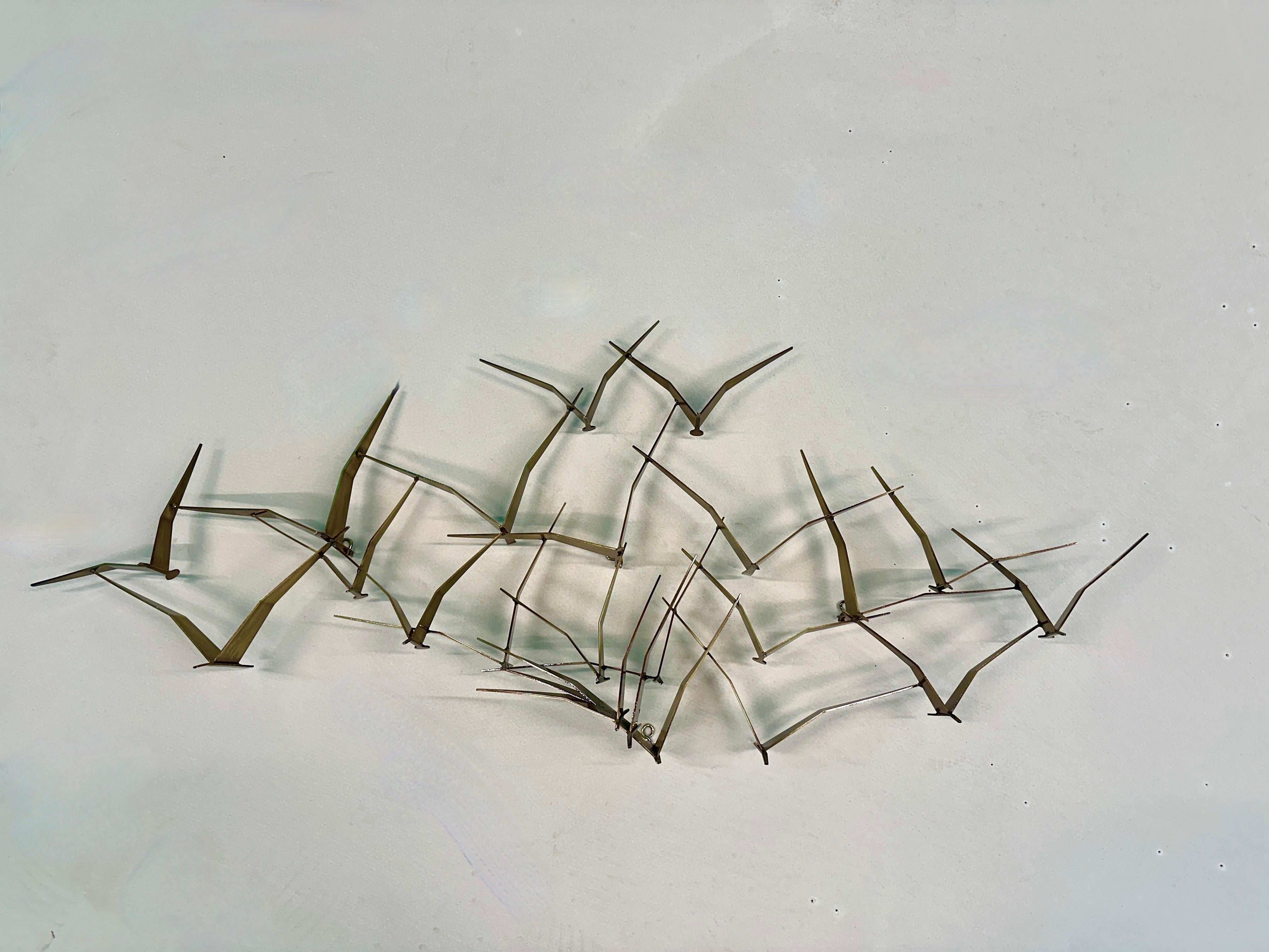 A Large wall sculpture in Bronze Patinated metal, By Curtis Jere signed in 1988. Depicting a flock of seagulls. 

C. Jeré (or Curtis Jeré, often seen without the accent) is a metalwork company known for wall sculptures and household accessories. C.