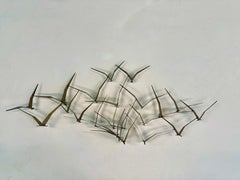 A Large Wall Mounted Sculpture By Curtis Jere