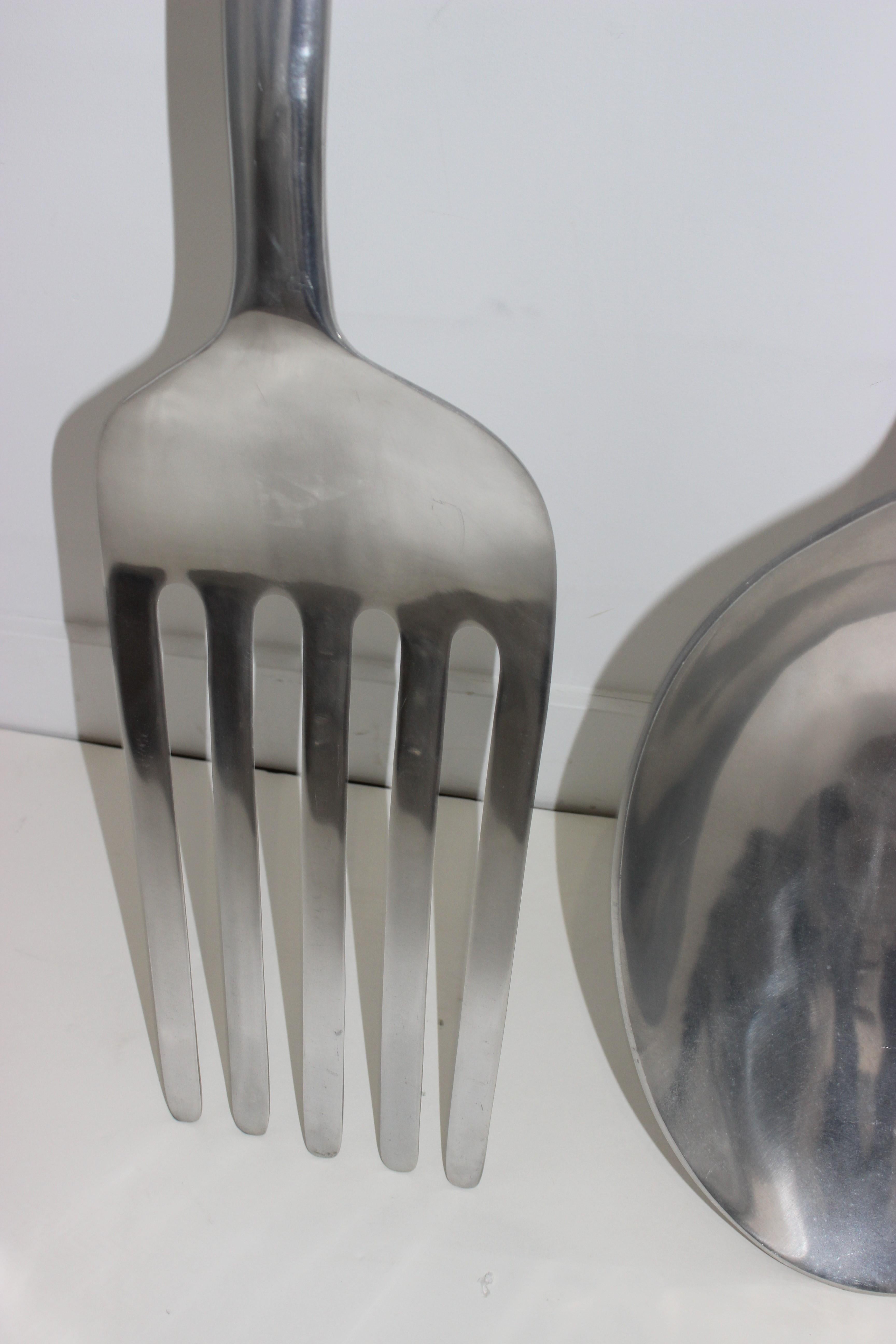 large metal spoon and fork wall decor