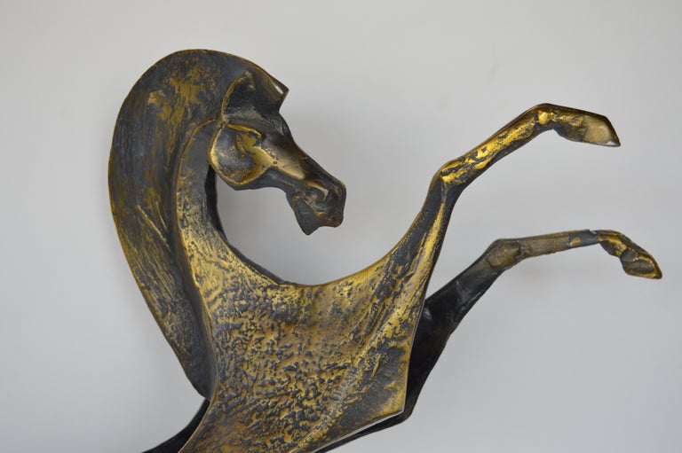 Metal Curtus Jere horse sculpture with bronzy patina.