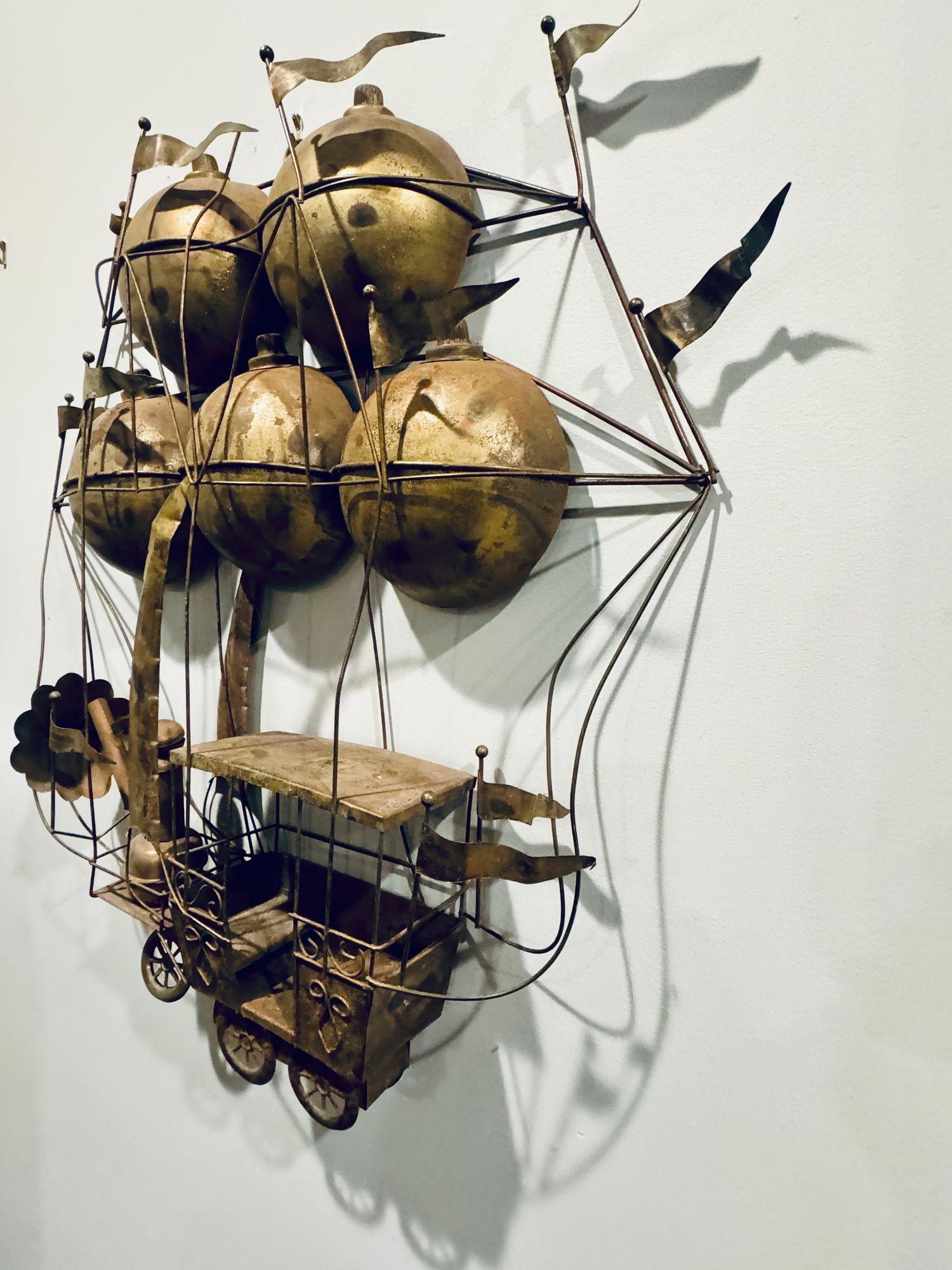 1970s Unsigned Wall Sculpture of a hot air balloon from Curtis Jere. You seldom see this piece come up for sale. This piece is in nice vintage condition. This piece is depicts a 18th Century French flying machine.