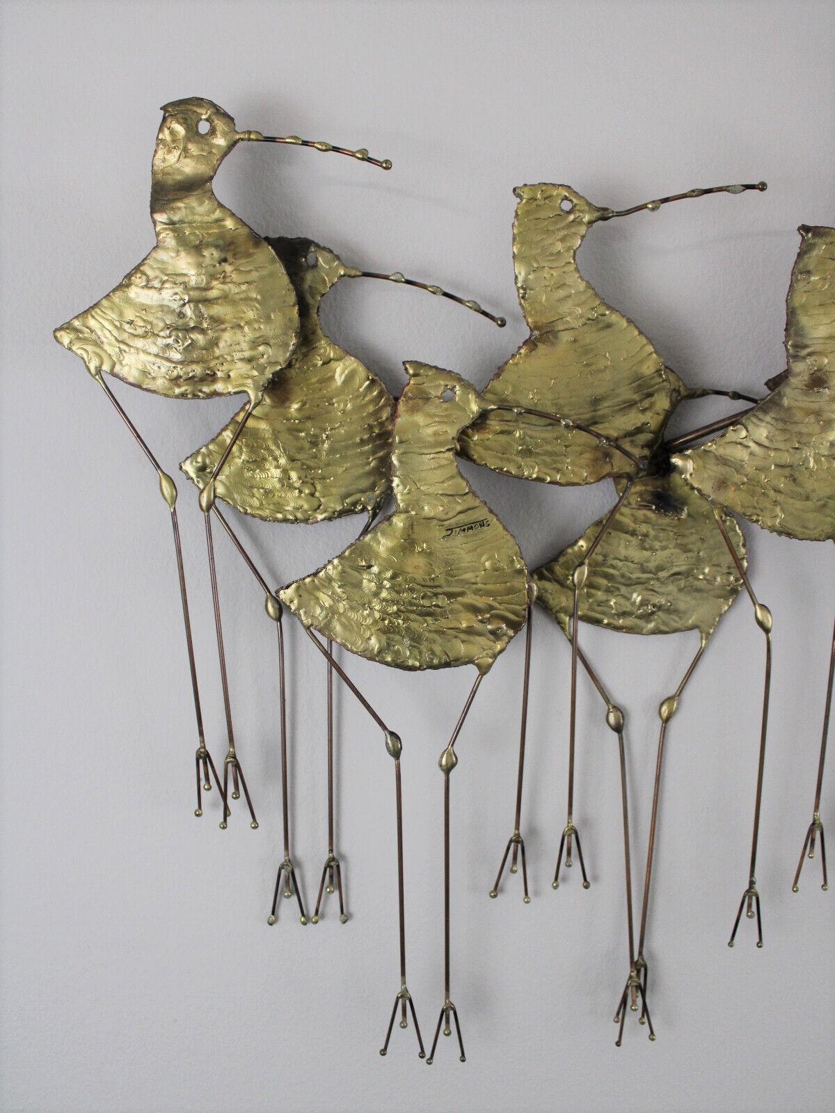 Hard to find large gilt metal wall sculpture, circa 1960s. This mid-century modern piece is in very good condition and has great gold color and texture. The sculpture displays patina consistent with age and is signed 