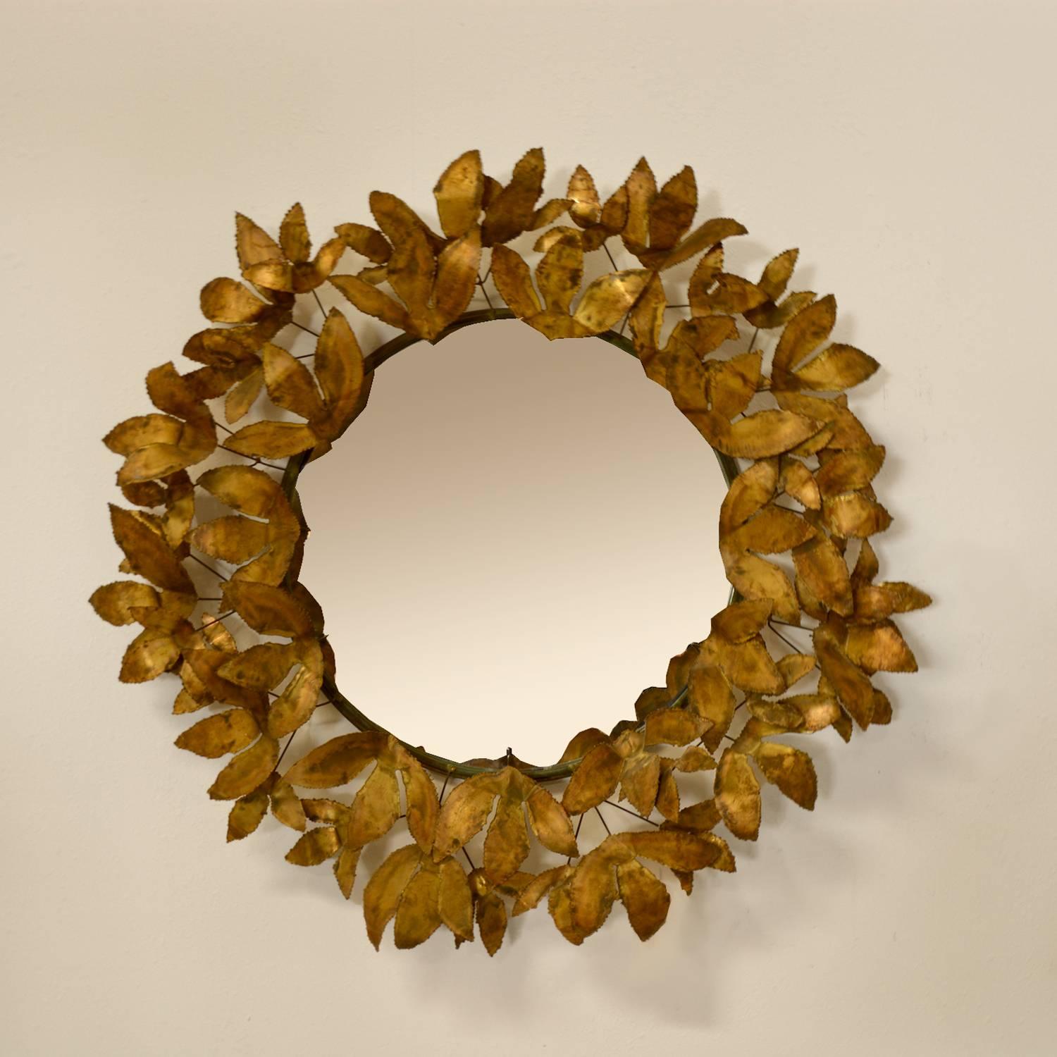 Stunning Curtis Jere leaf mirror. Rare form, with torch cut patinated brass ‘leaves’ in place of the typical raindrops. American Circa 1970’s