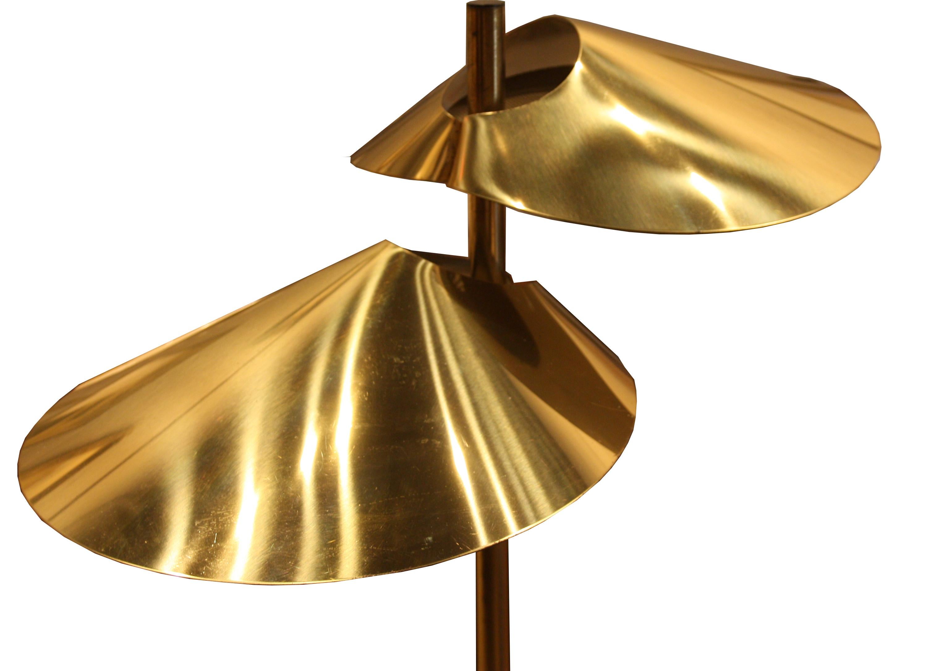 Signed and dated 1977 Curtis Jere two-light floor lamp. Each light has a brass 