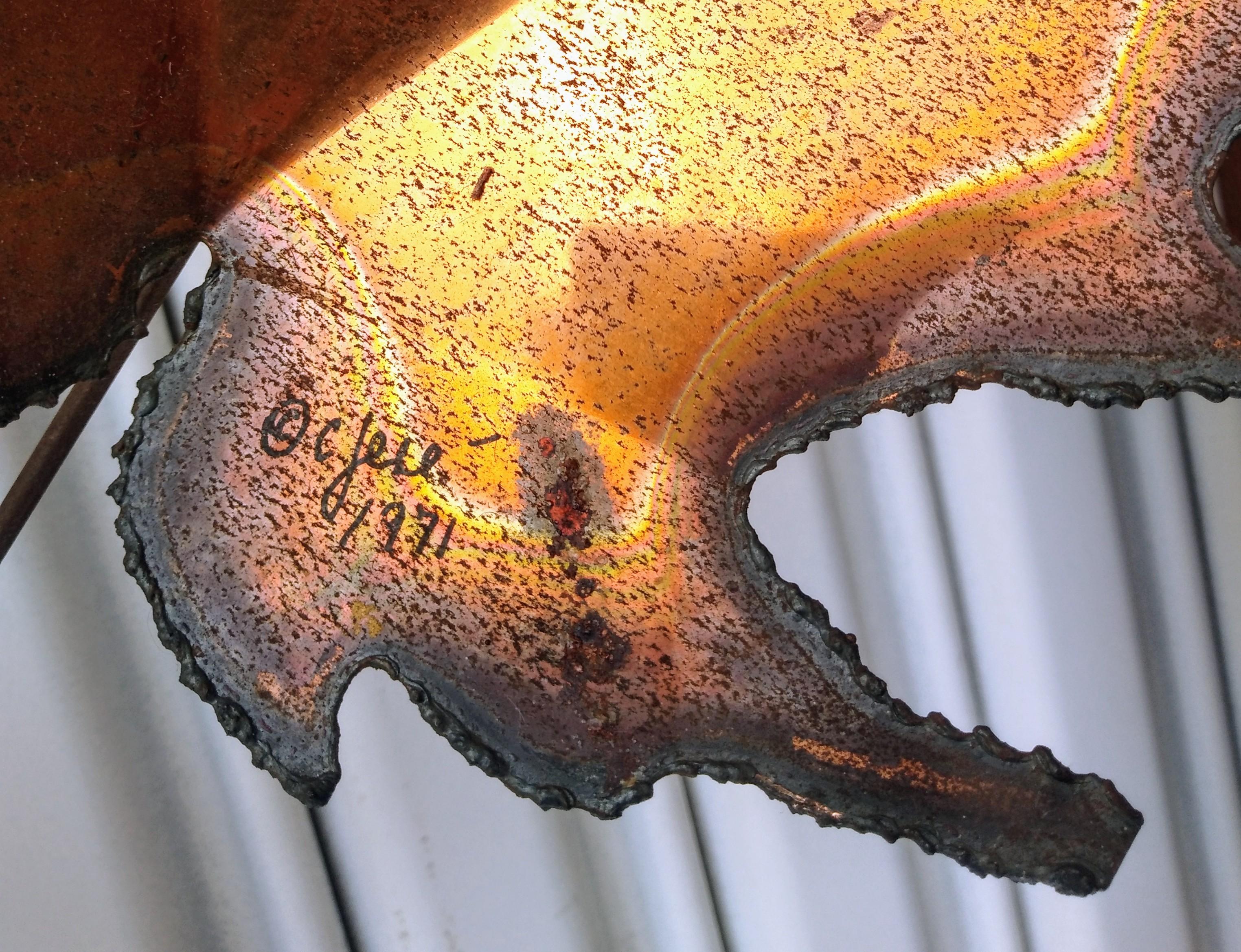 This is a large Maple Leaf sculpture by Curtis Jere. It's made of welded brass and copper by one of the 20th century's most popular and prominent designers.
It's signed on the maple leaf.

This would make a really good addition for any home interior