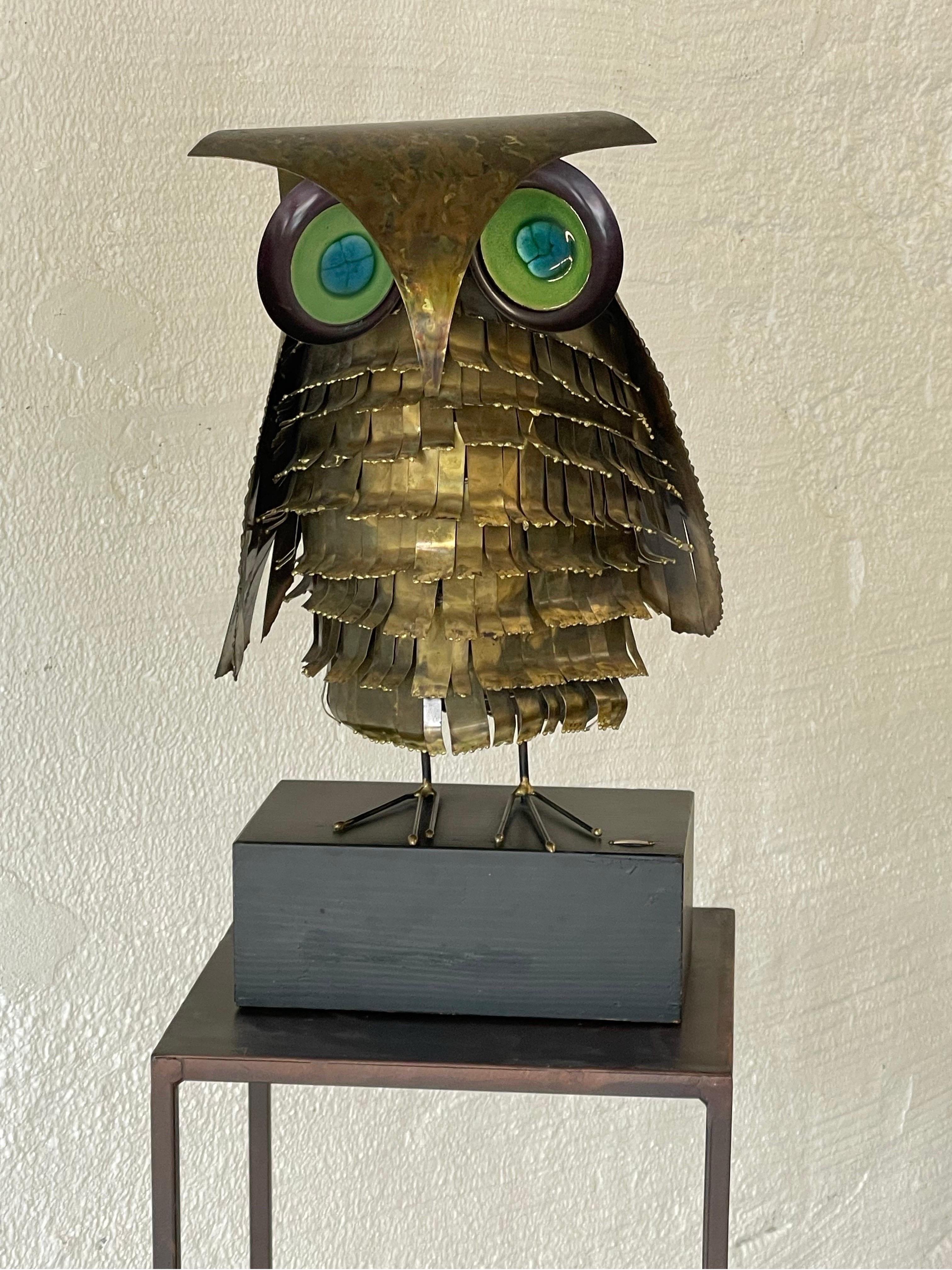 Original 1968 Curtis Jere metal owl sculpture featuring a richly patinaed metal body with multi color enameled eyes. Signed 