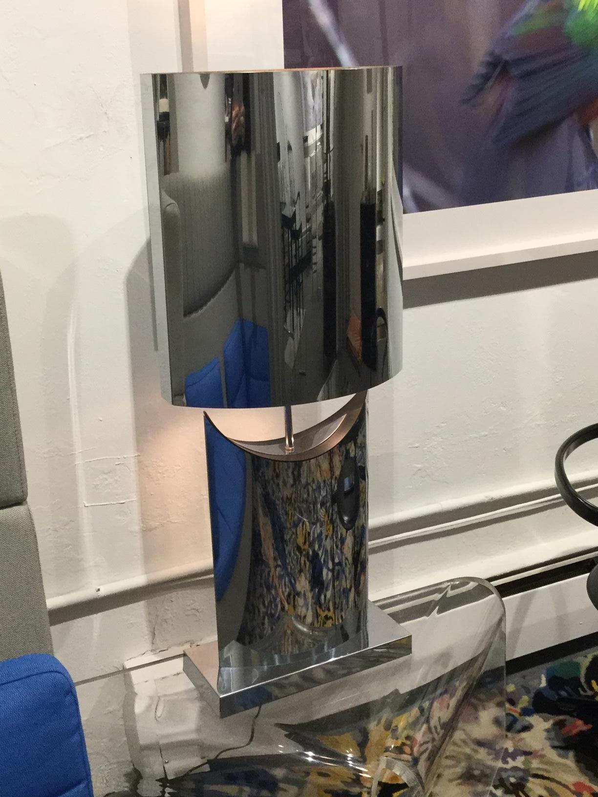 A large mirror polished stainless steel table lamp by Curtis Freiler & Jerry Fels for Curtis Jere.

C. Jeré works are made and marketed by the corporation Artisan House. Curtis Jere is a partnership of two artists Curtis Freiler and Jerry Fels.