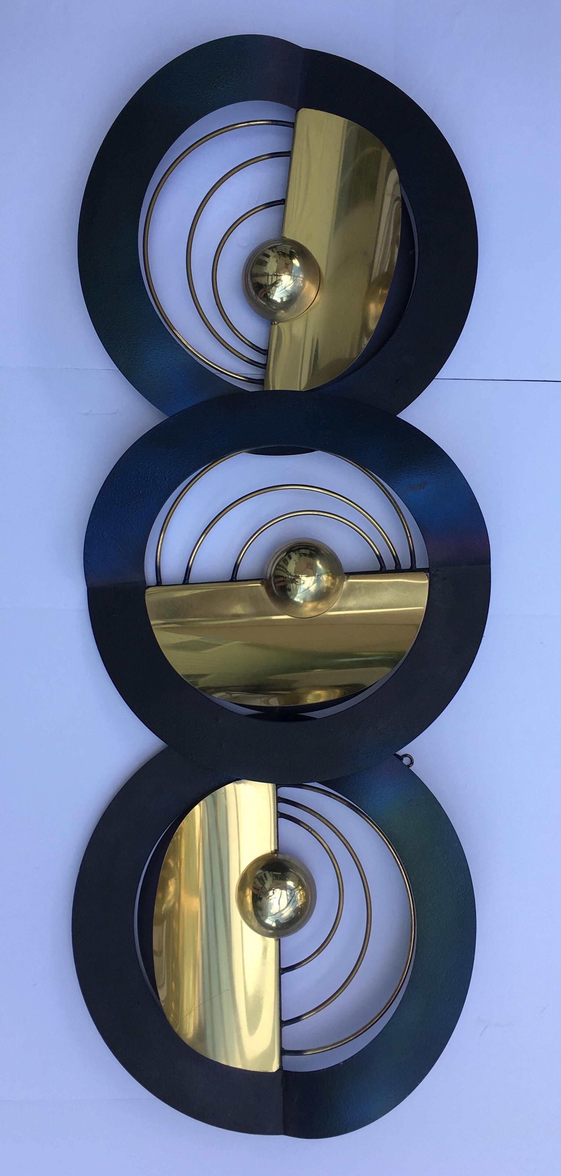 Large modern mixed metal wall sculpture by Curtis Jere. This dimensional art piece features an iridescent black finish combined with vibrant polished gold brass. This piece can be displayed vertically, horizontally, or any desired angle. Signed and