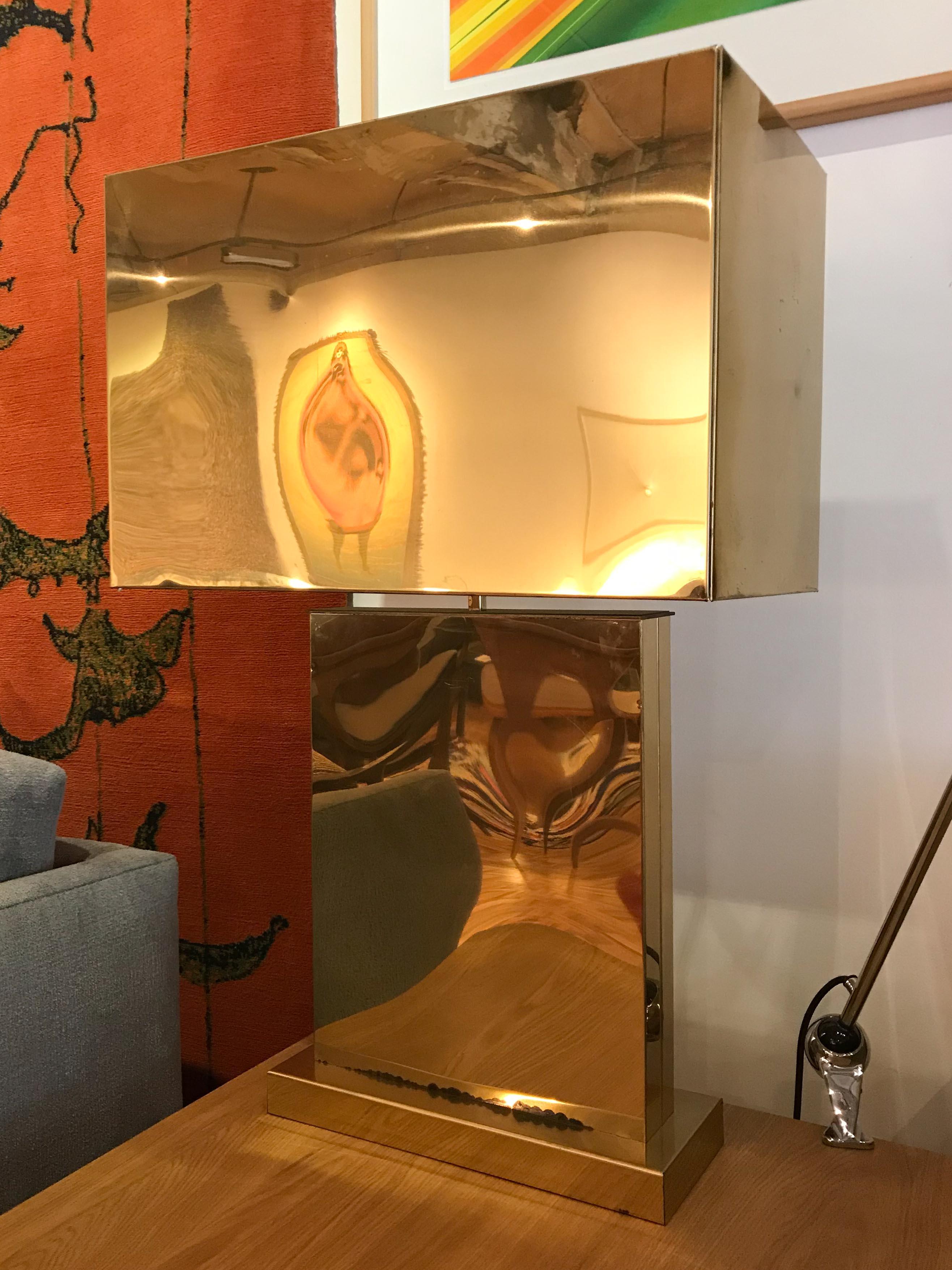 Monumental polished-brass table lamp by Curtis Jere. Very good vintage condition with normal wear and patina, some minor irregularities in the finish, small ding in shade, please see photos. Original wiring, signature on base near cord has somewhat